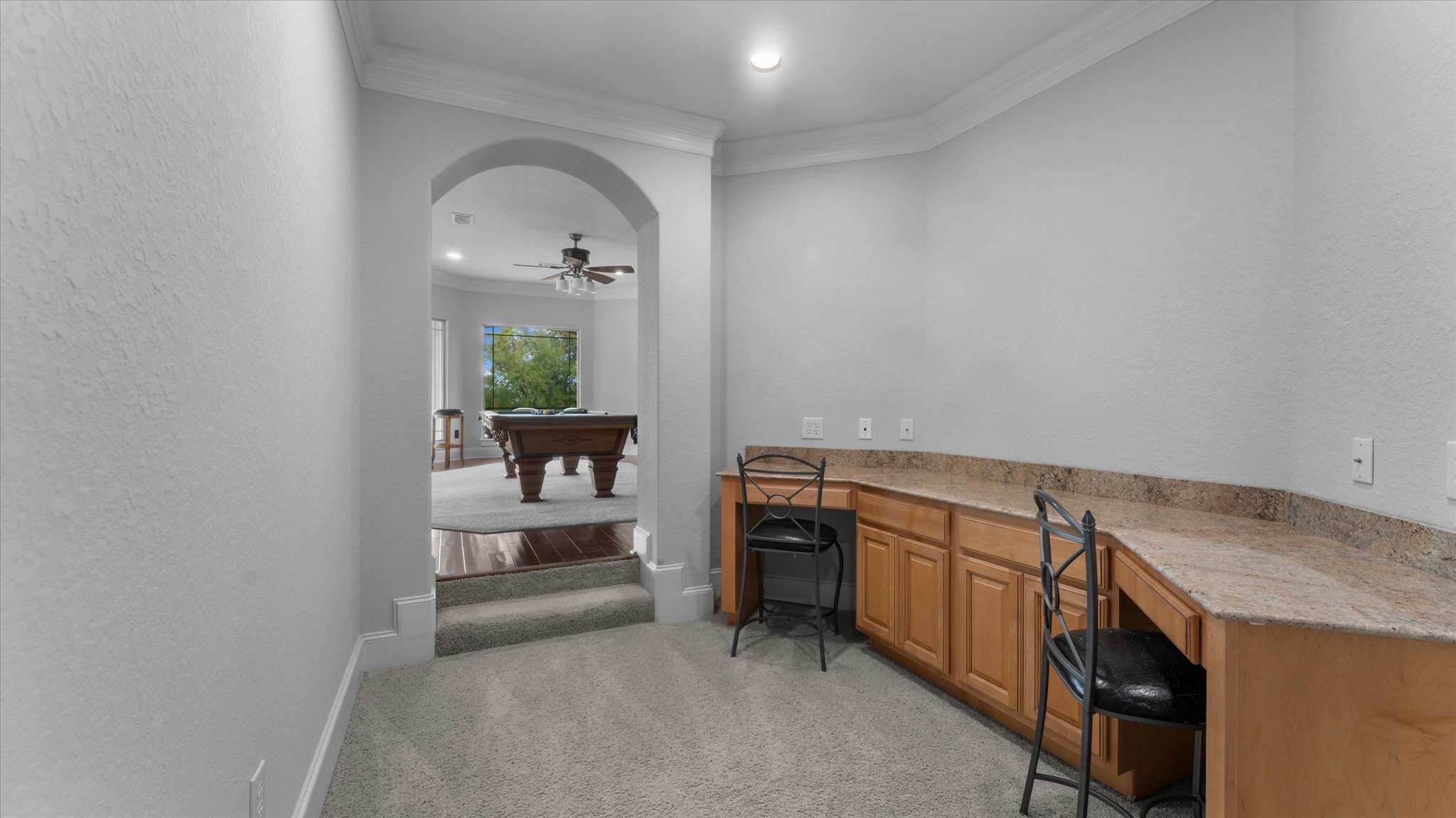 Next to the office and leading to the gameroom is another area to study or work.