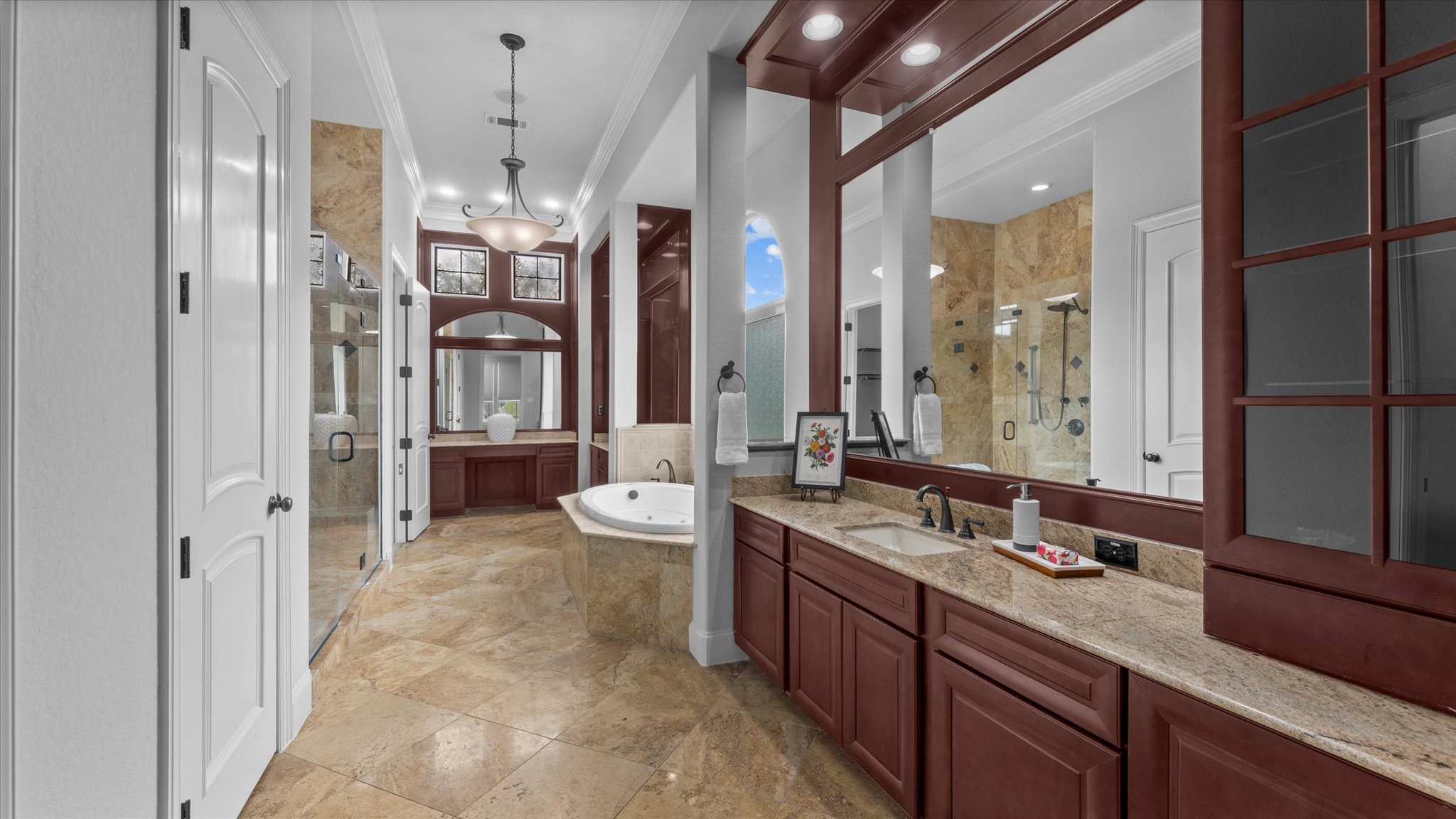 The primary bathroom contains two sink areas.