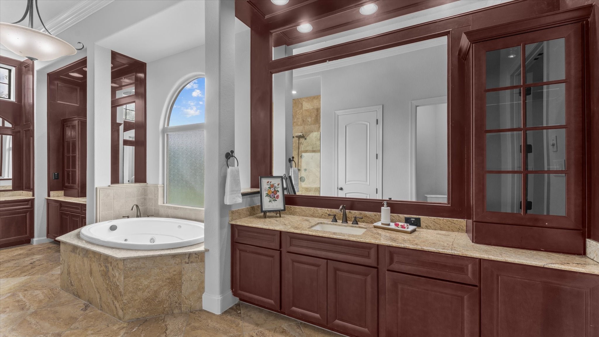 This incredible bathroom has a jetted tub and separate shower.  The bathroom also has two massive walk-in closets.