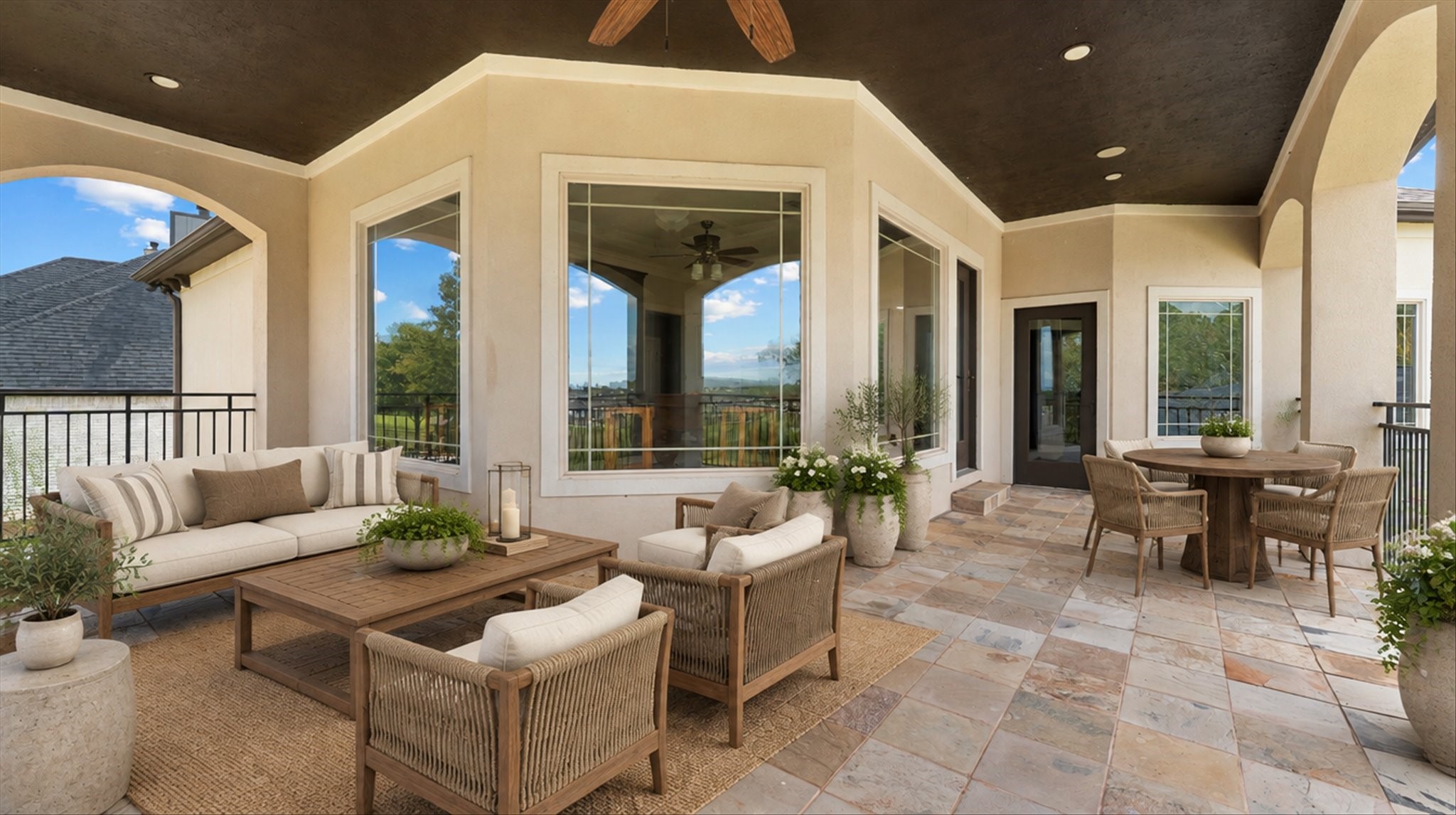 Covered patio on the back of the home.  Staged.
