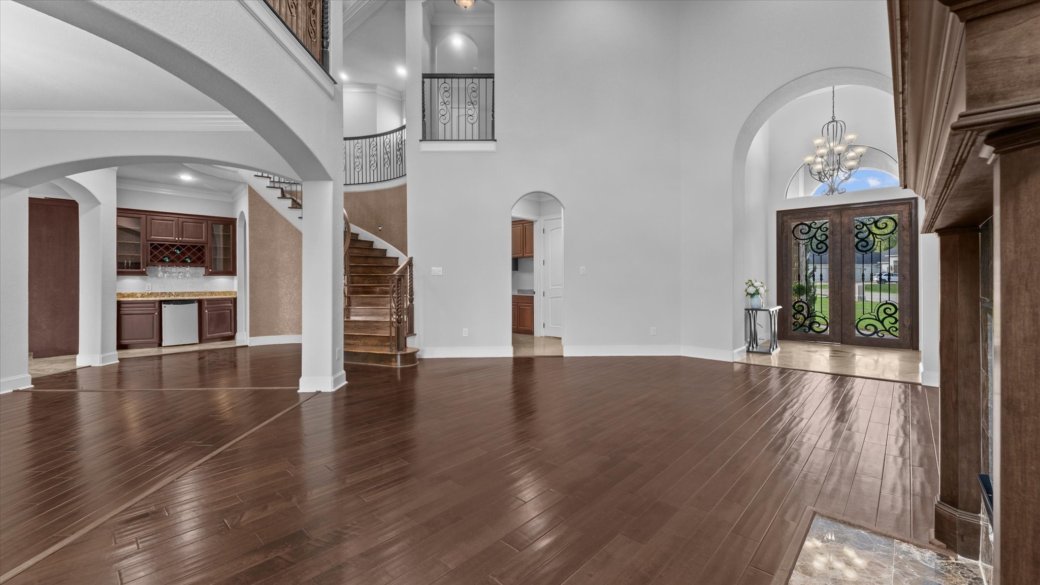 Immaculate wood floors. Living room opens to the dining room on the left. Straight ahead is the powder bath and then the hallway leads to the laundry room. Immaculate wood floors. Living room opens to the dining room on the left. Straight ahead is the powder bath and then the hallway leads to the laundry room.