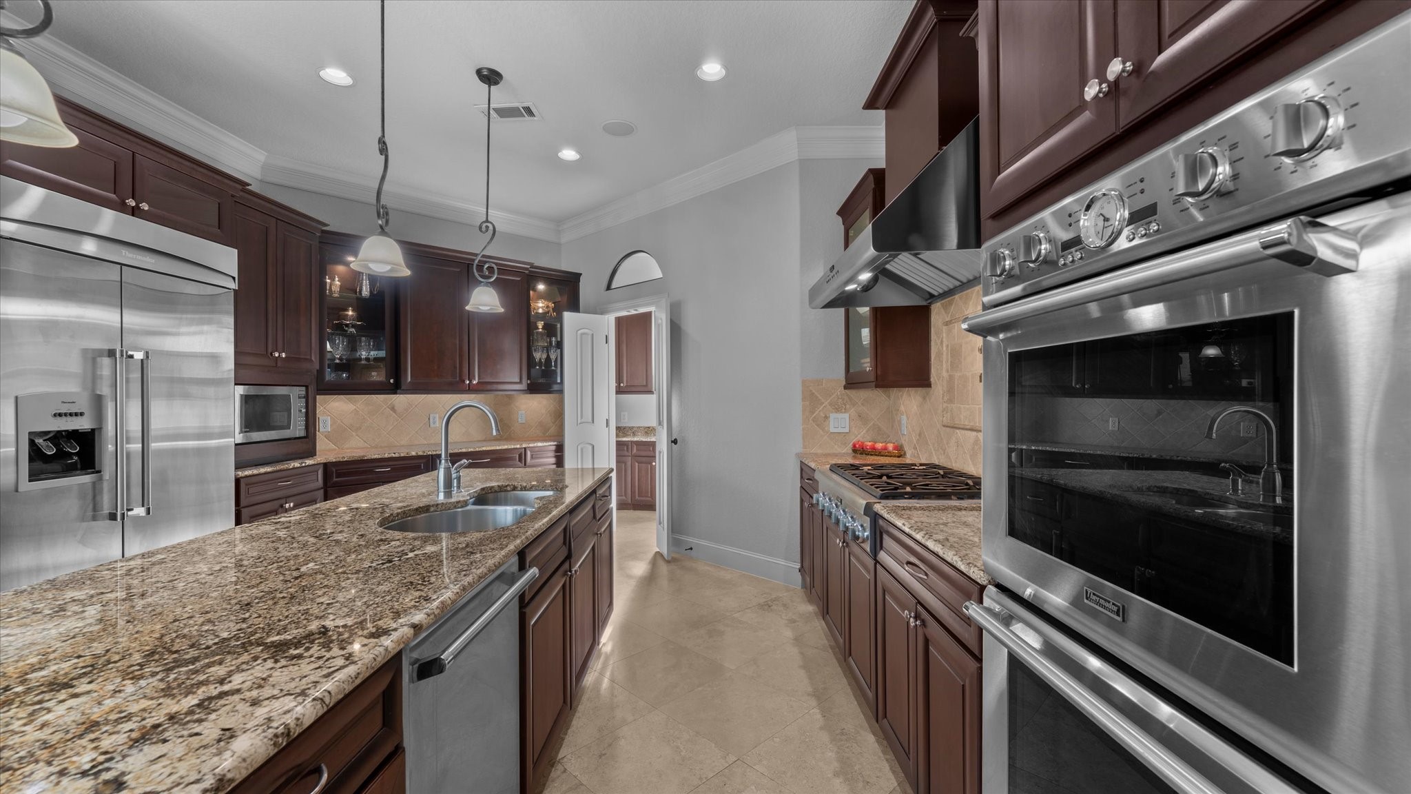 The kitchen is large with lots of counter space.  Thermador refrigerator.