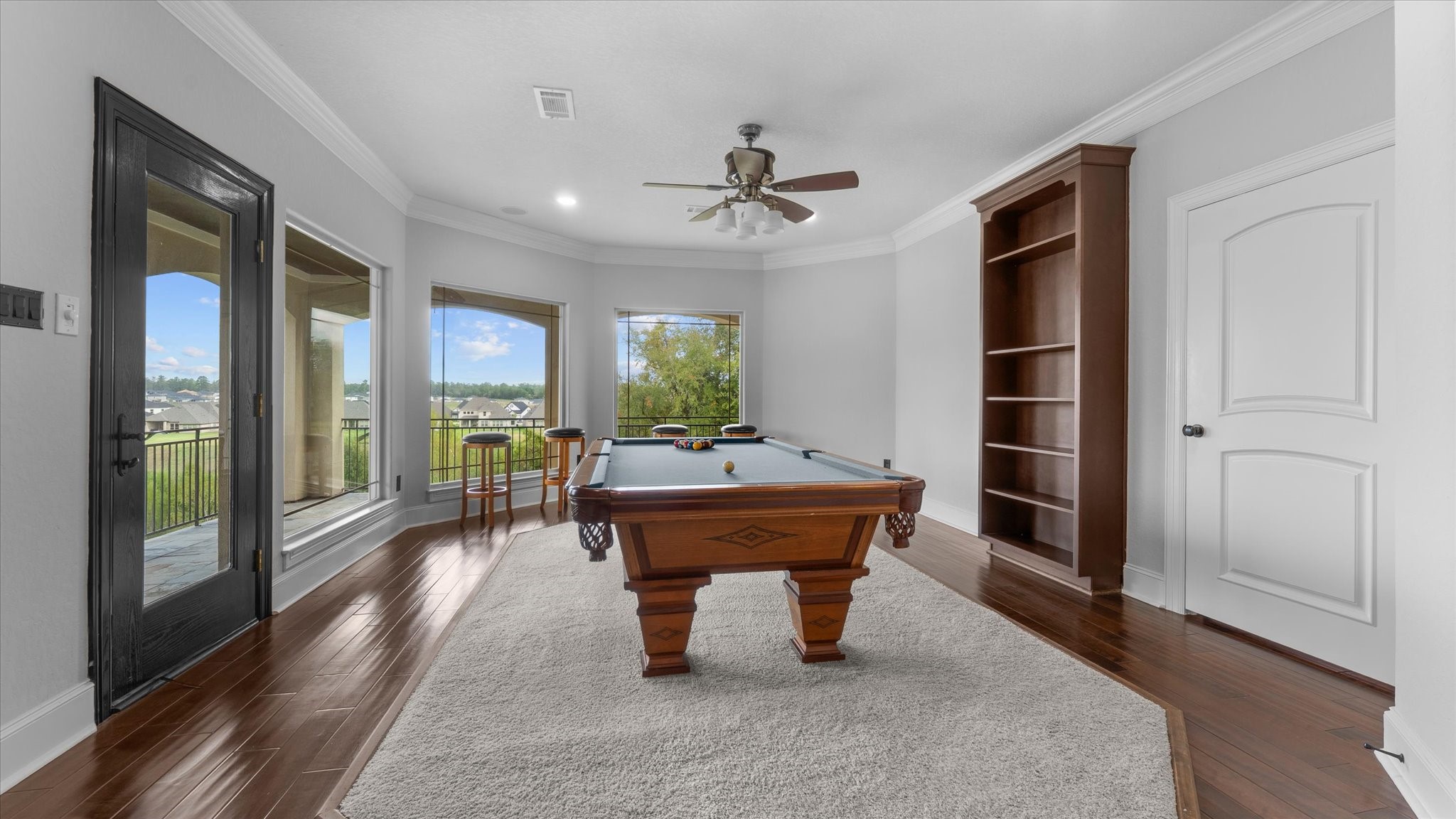 Gameroom with a fabulous view and an outside attached balcony.  To the right is the door to the media room.