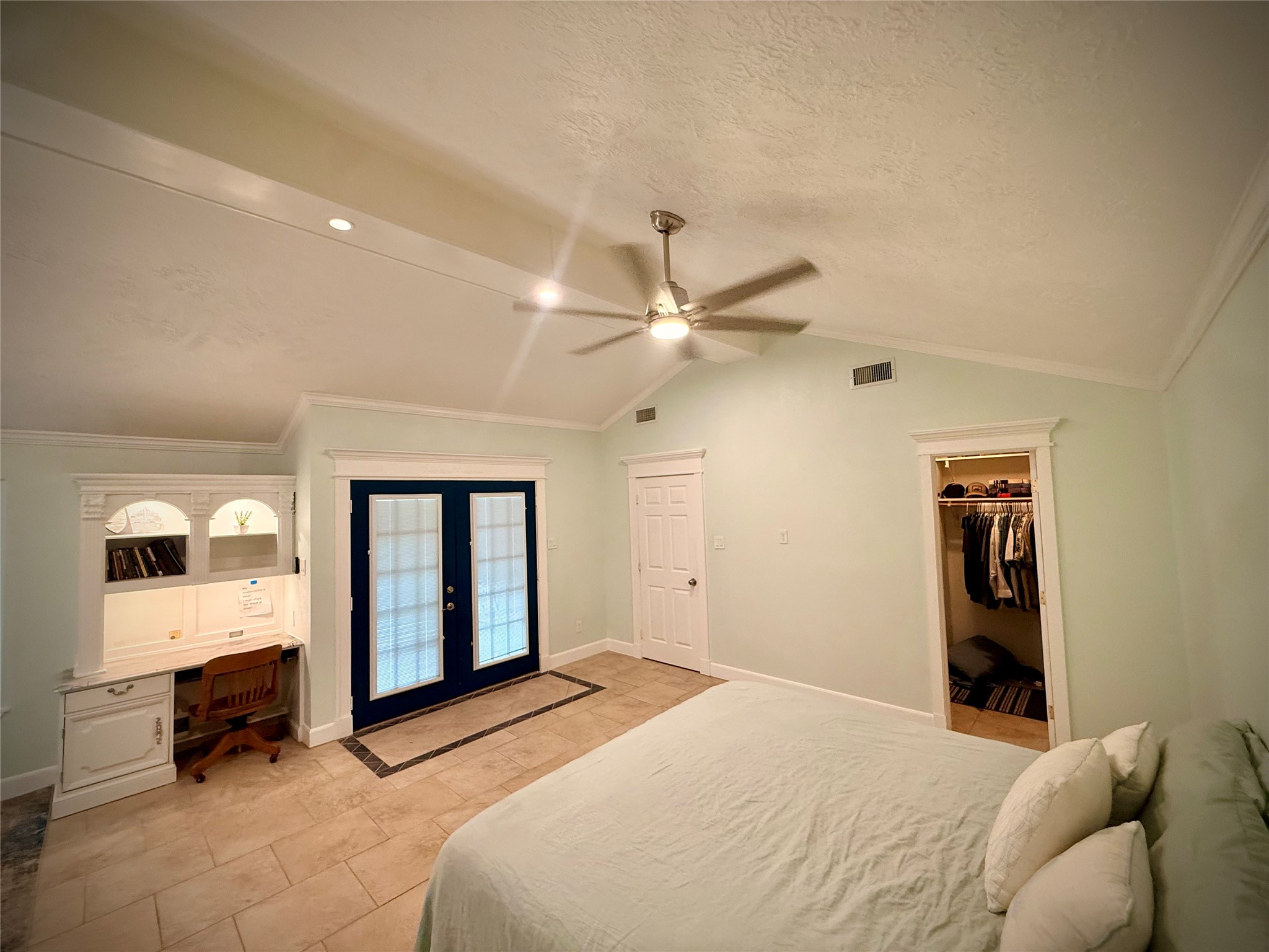 Primary Suite with doors leading to the back yard