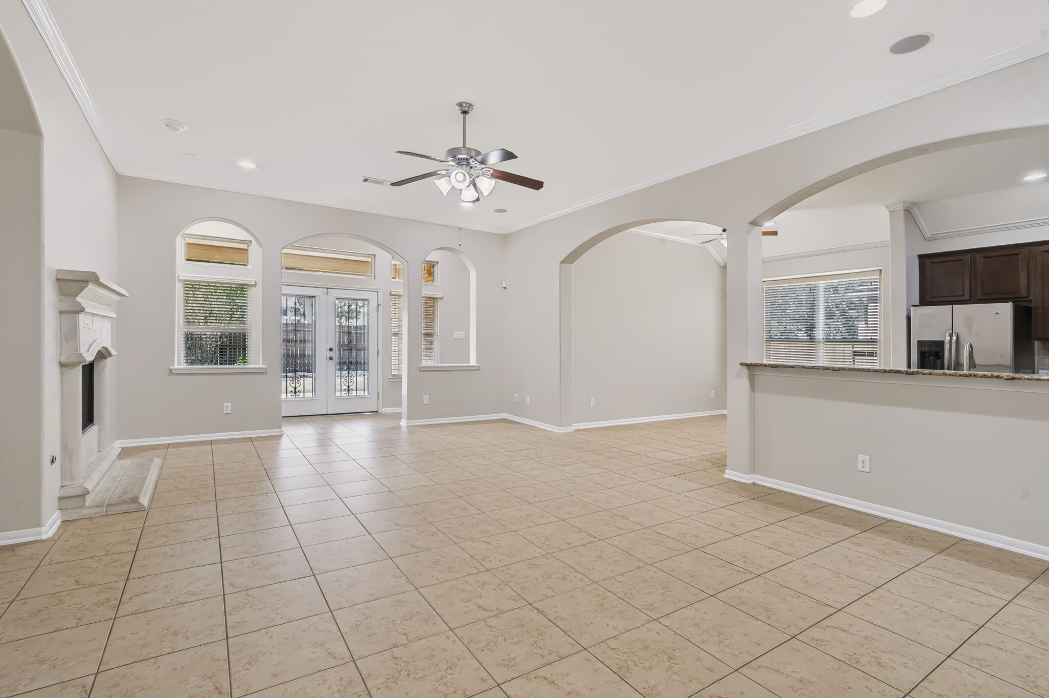The open-concept kitchen flows into the breakfast area and family room, creating an inviting, connected living space for entertaining and everyday living.
