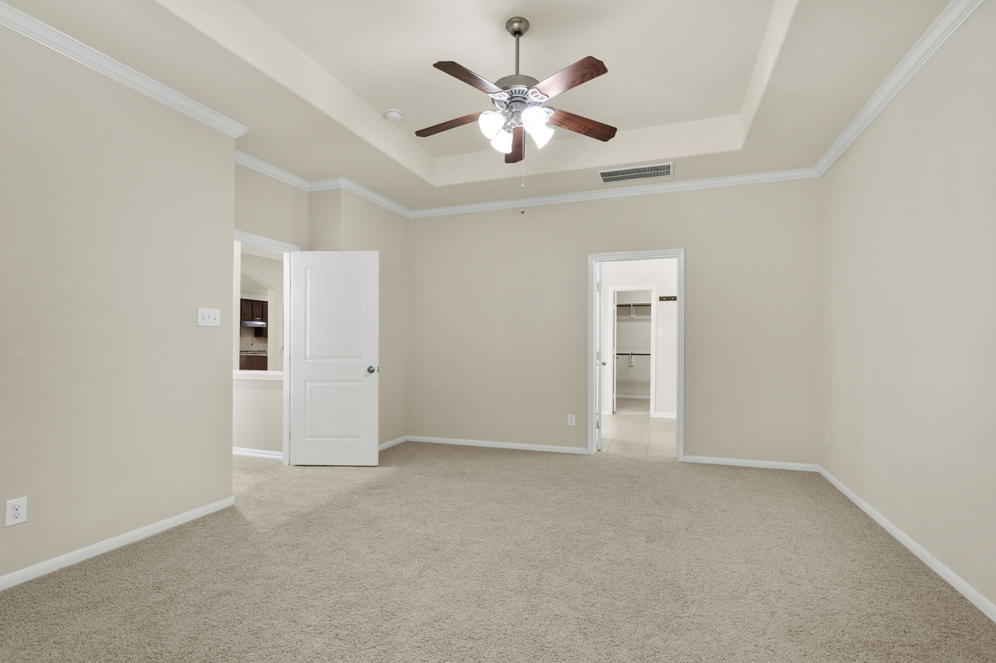 View of the primary suite highlighting the entrance and en suite bathroom.