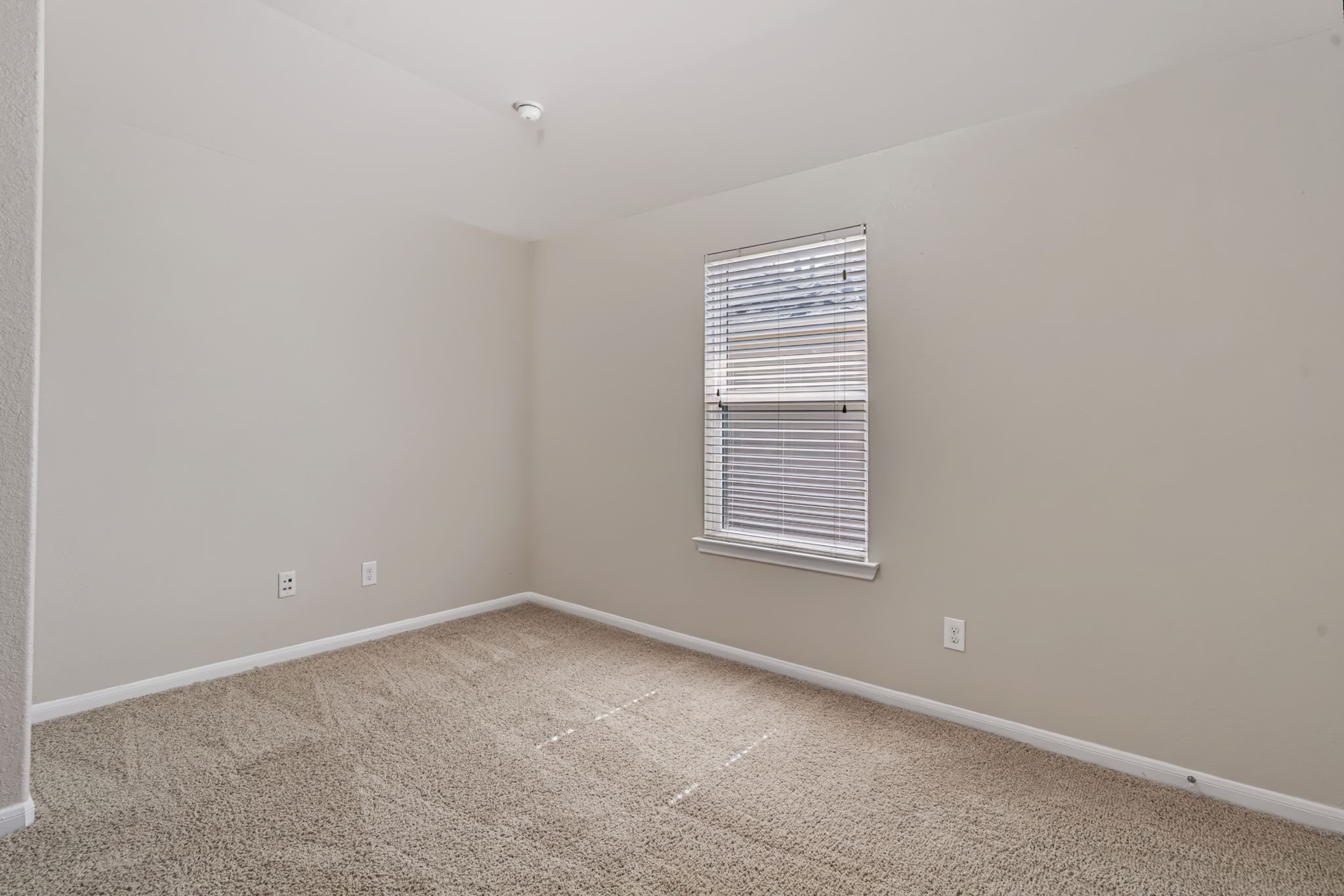 Located away from the four bedrooms downstairs, the second-story bedroom offers privacygreat for in-laws, guests, or a college student.