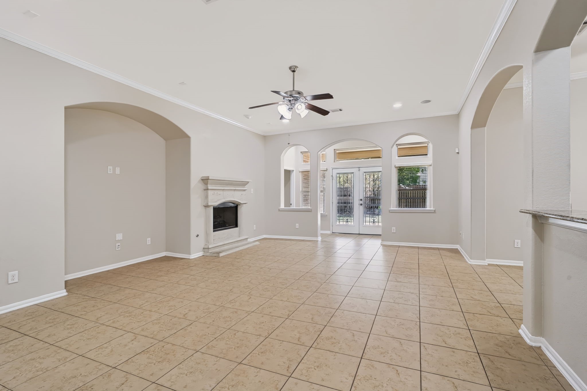 Tile flooring throughout the main living areas offers durability and easy maintenance.