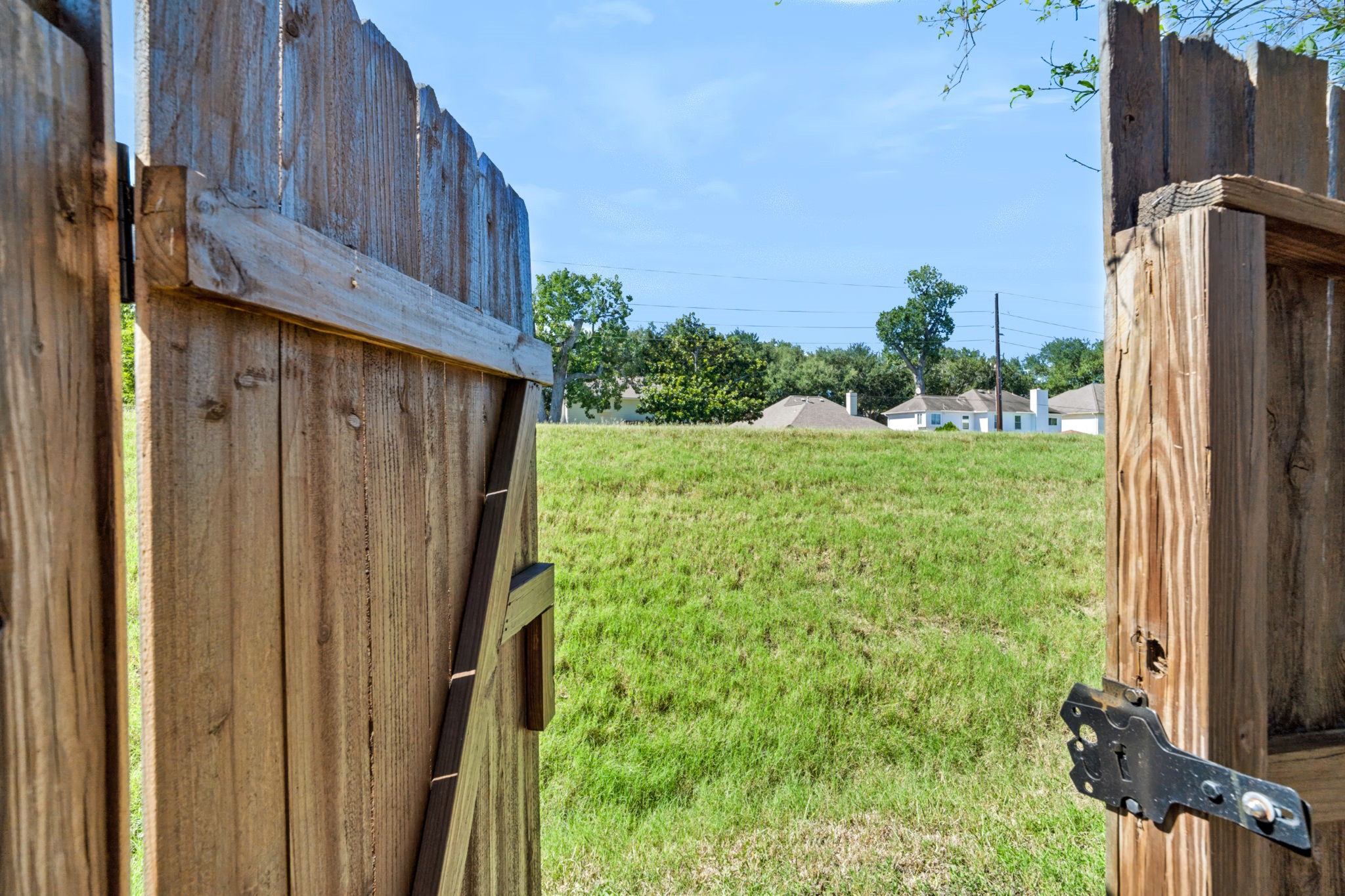 A back gate opens directly to a greenbelt, great for dog walks or mountain biking.