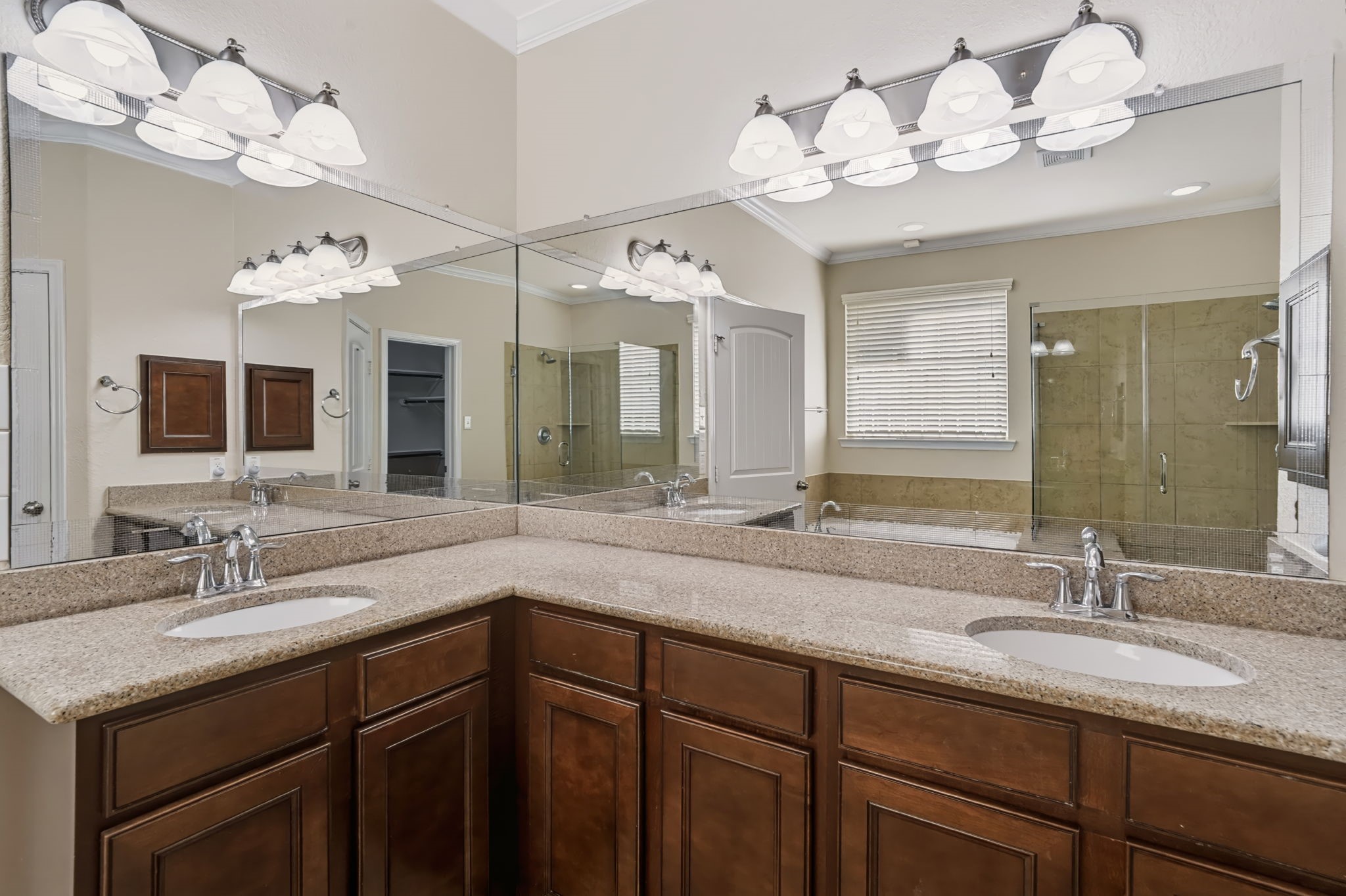 Dual vanity in the primary bath provides plenty of space for two to get ready in the morning.
