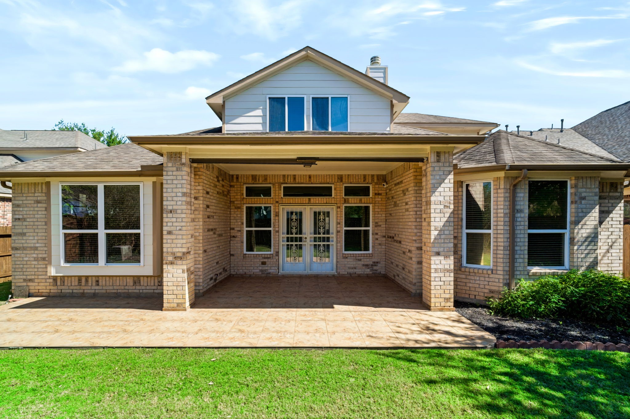 French doors with exterior gates provide enhanced security.