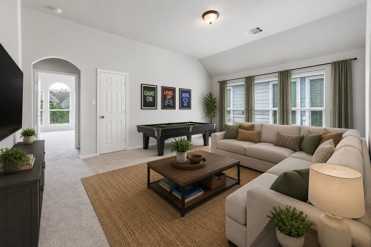 Upper Level LOFT -Use for Gameroom etc /Designer arched doorway leads into a large bonus room with closet, new carpet and fresh paint...Lots of energy efficient windows! Virtually staged to inspire design possibilities