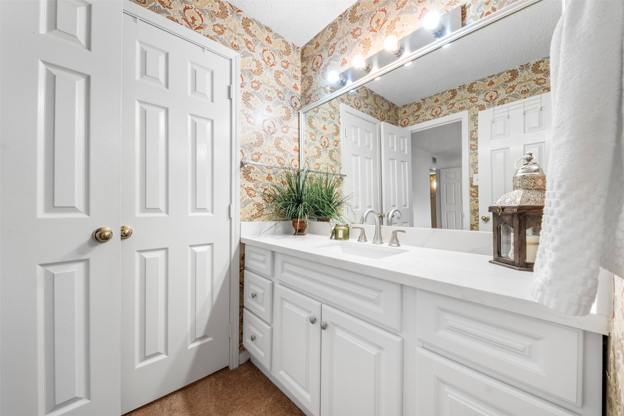 Primary bathroom with view of walk in closet.