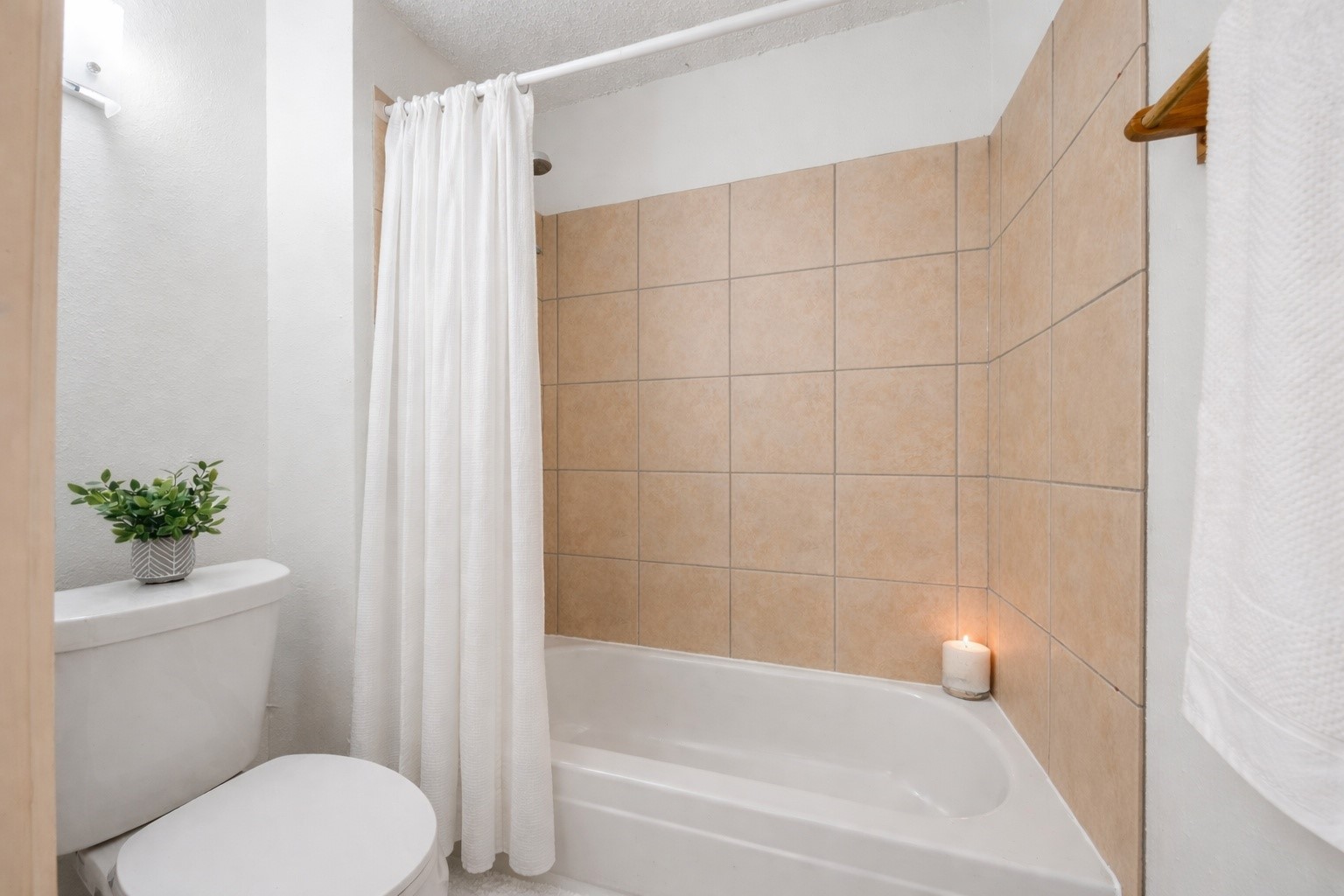Primary bathroom with separate toilet and shower area.