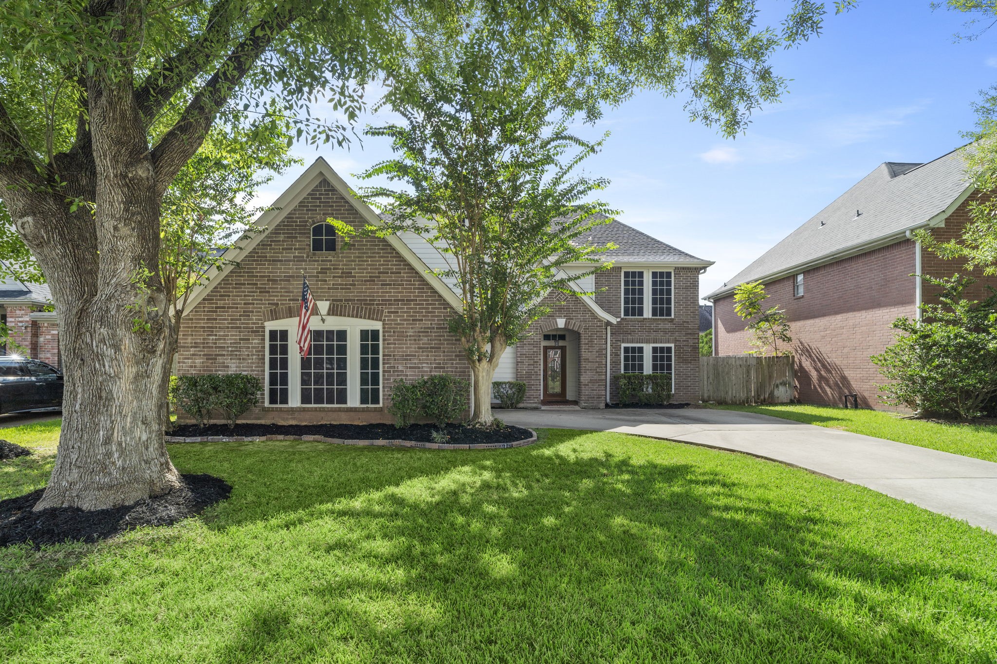 **NEW ROOF!** Mature trees, a long driveway & classic brick exterior welcome you home to this beautifully maintained First Colony property, ideally located in the heart of Sugar Land.