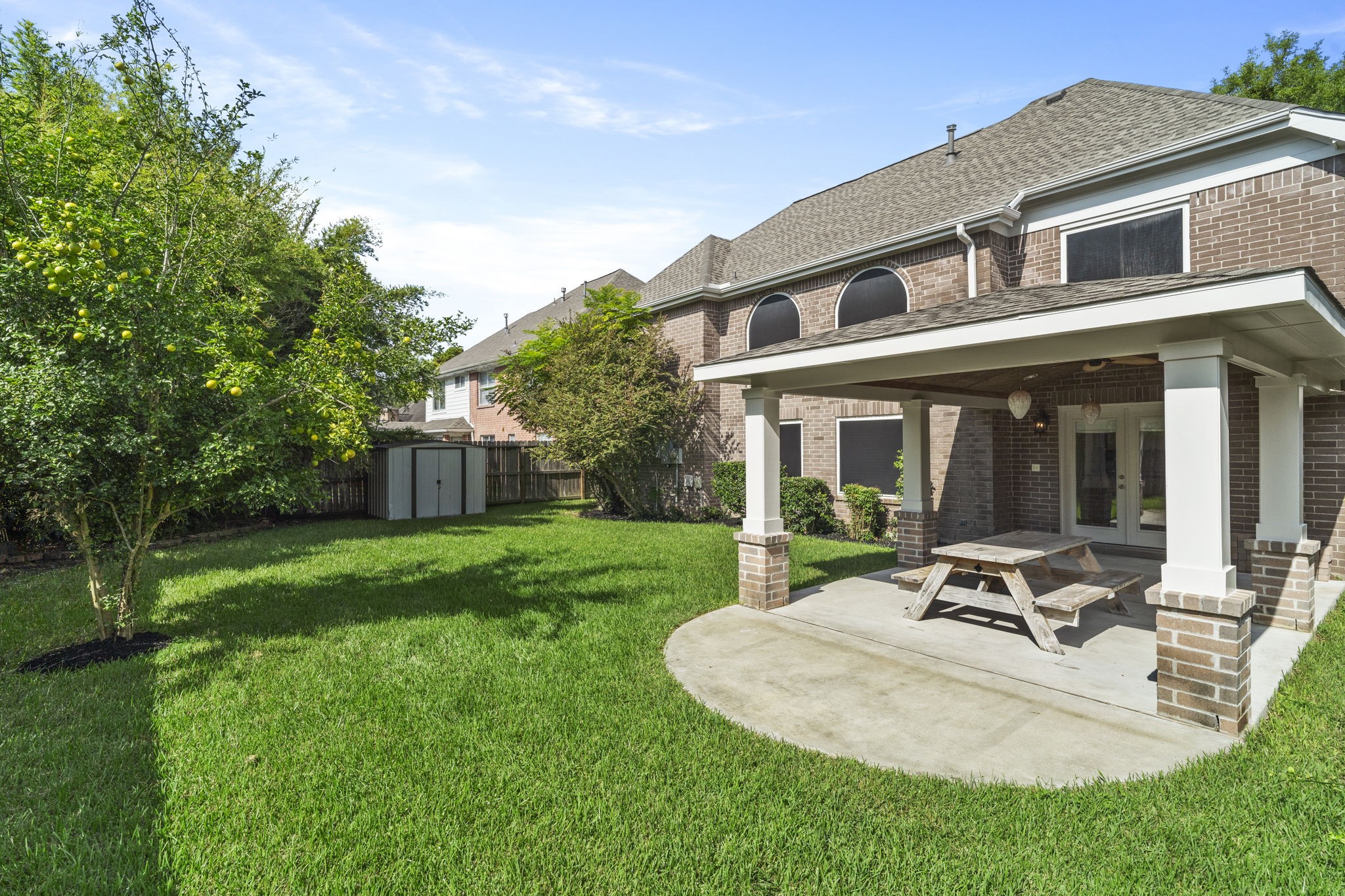 Spacious backyard with mature landscaping & plenty of room to play, relax or entertain.