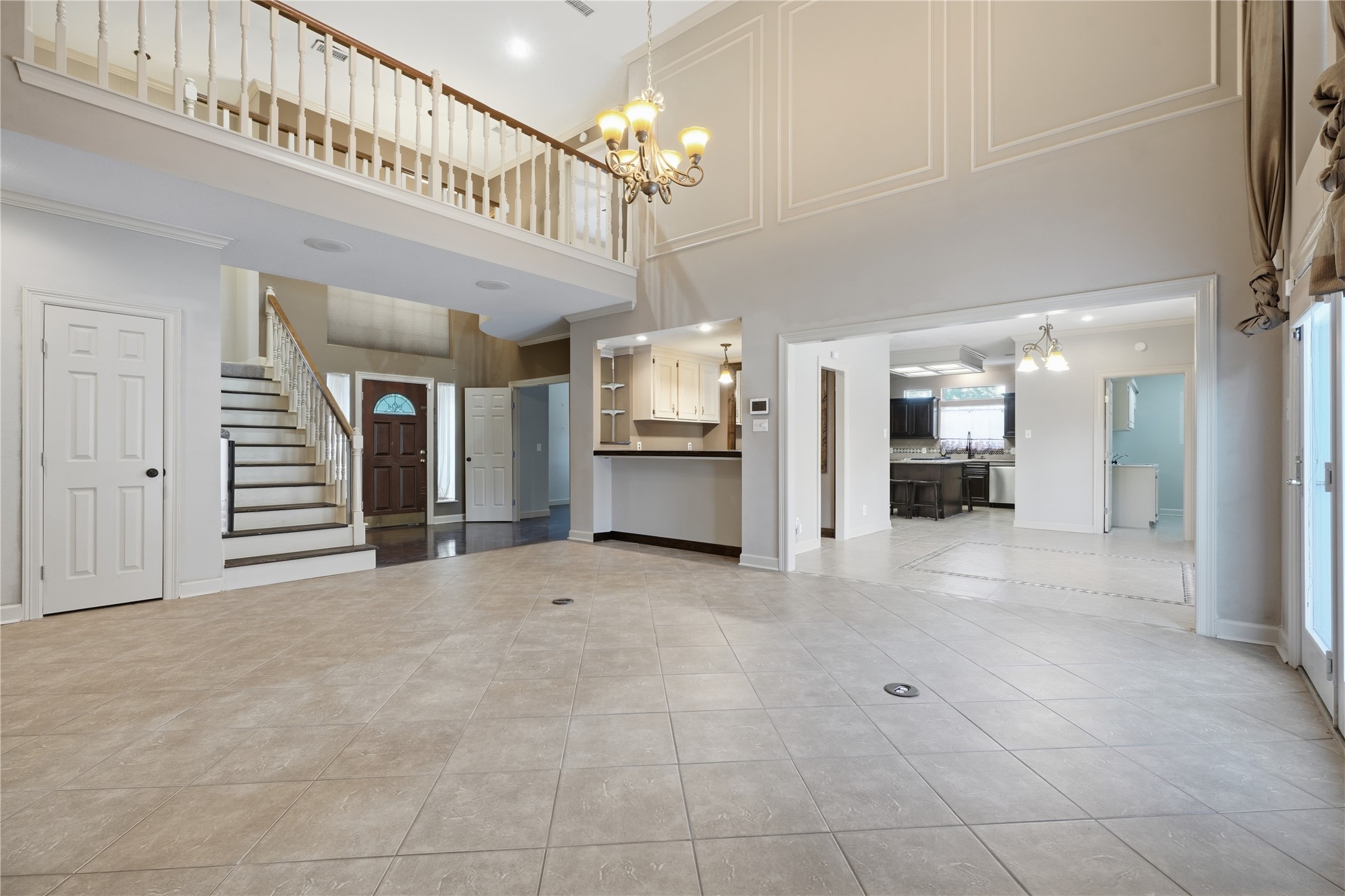 Massive living area with tall ceilings Massive living area with tall ceilings