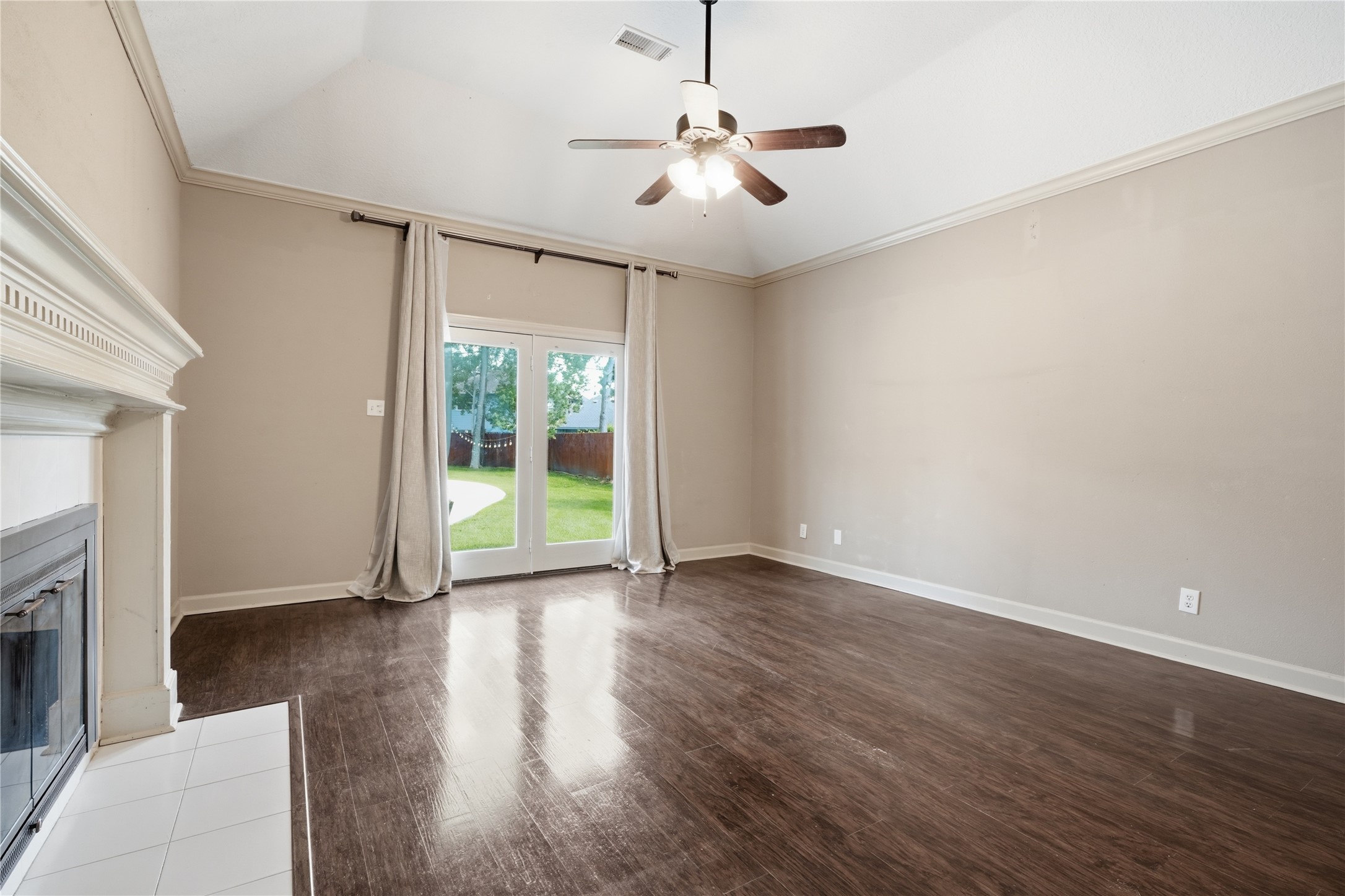 incredible primary suite with fireplace doors to outdoors