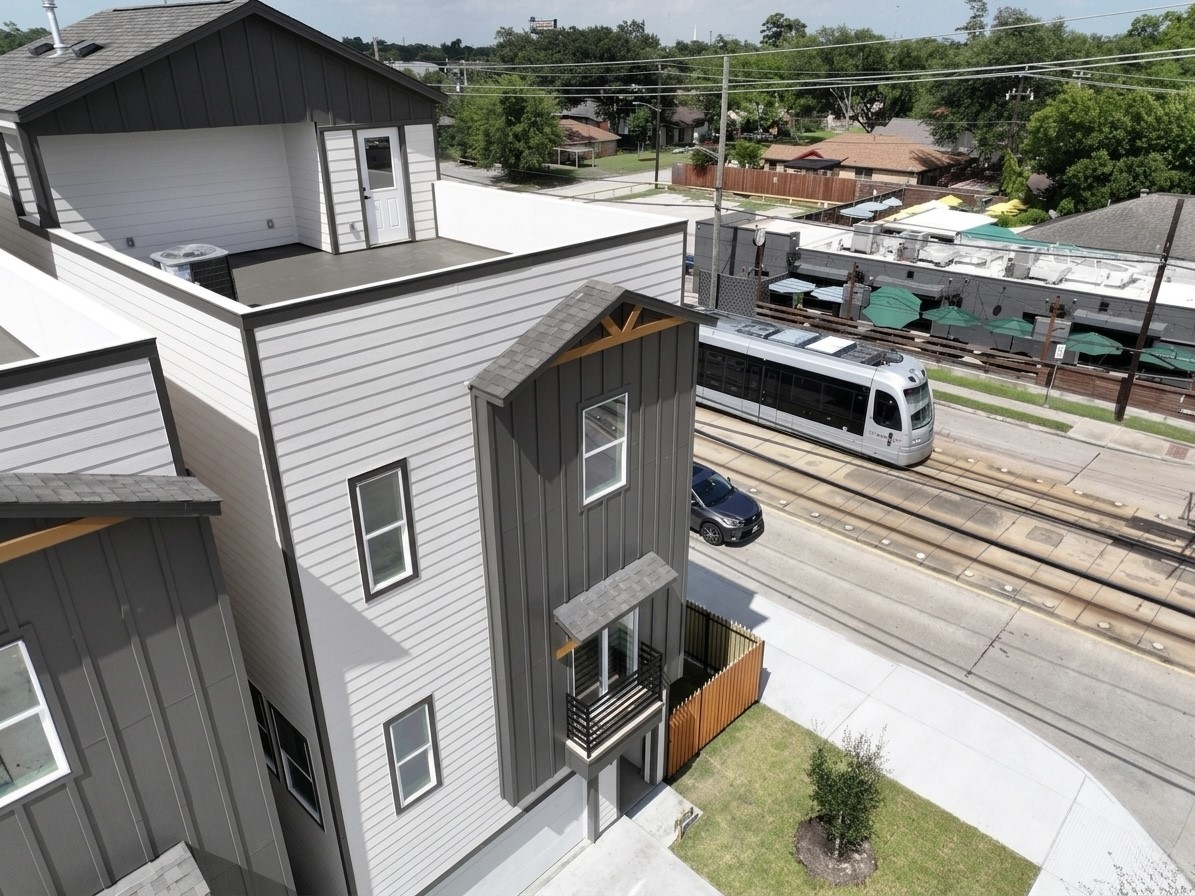 Contemporary multi-level home with a spacious rooftop terrace, conveniently located near a light rail line for easy commuting.