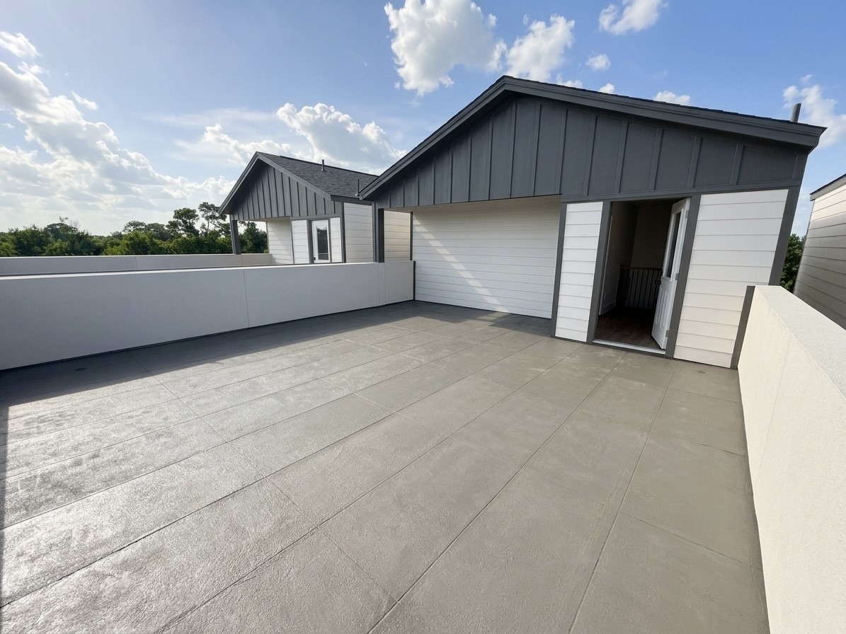 Expansive rooftop terrace offers ample outdoor space with scenic views, perfect for relaxation and entertaining.