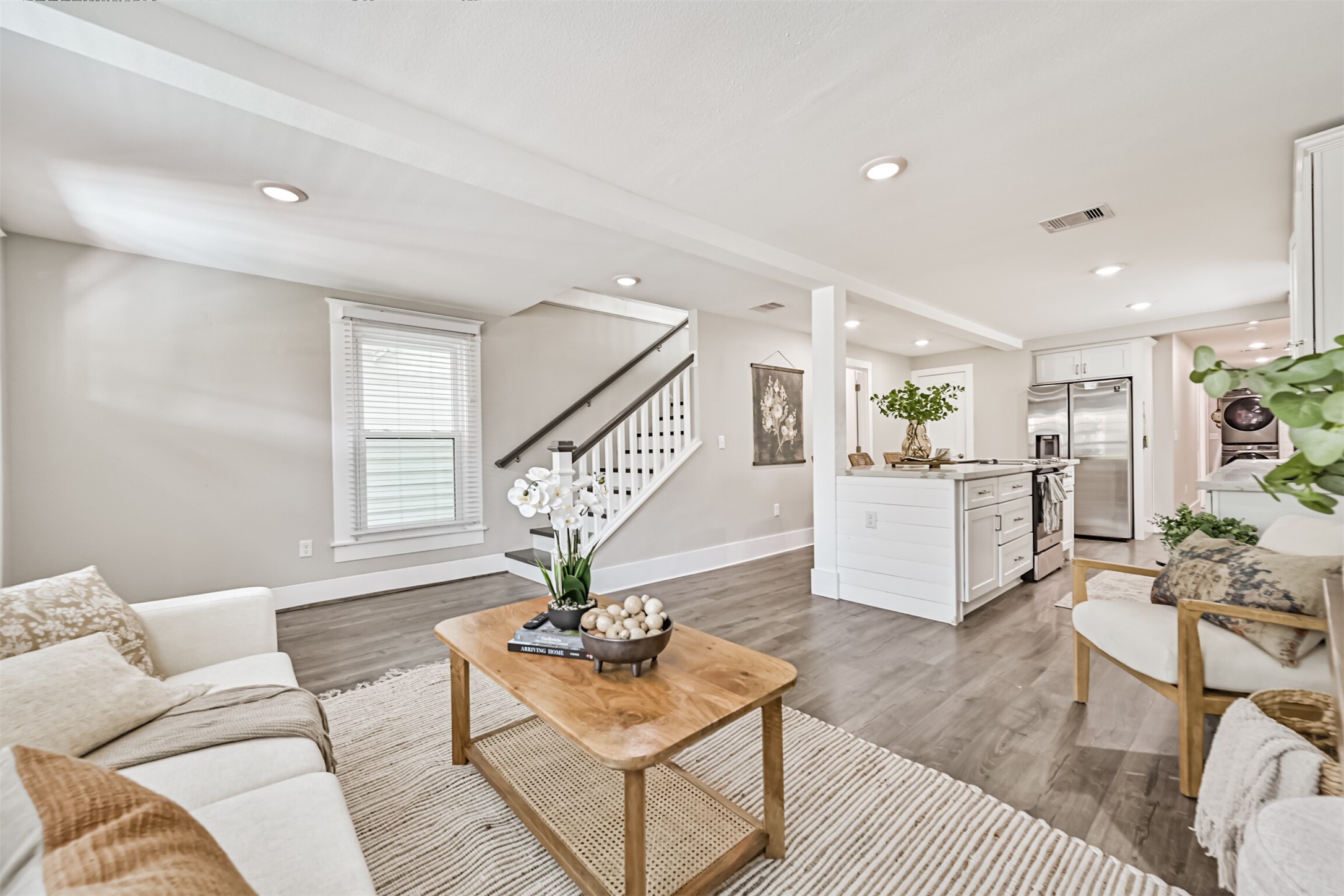 Open concept living area that flows into the beautiful kitchen.