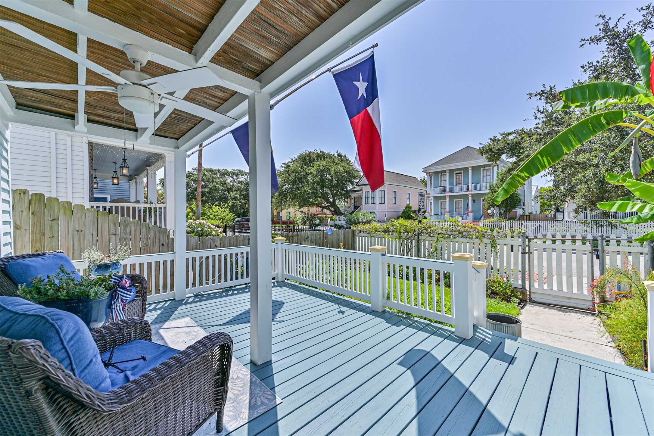Large front porch with ceiling fan.