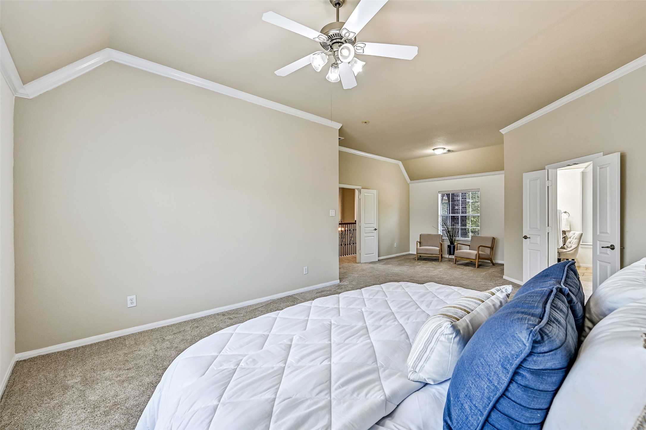 One of the standout features of the primary suite is this expansive sitting area, offering the perfect space for a reading nook, home office, exercise area, or private lounge. Large windows provide natural light, while the generous dimensions showcase the incredible scale of this upstairs retreat.
