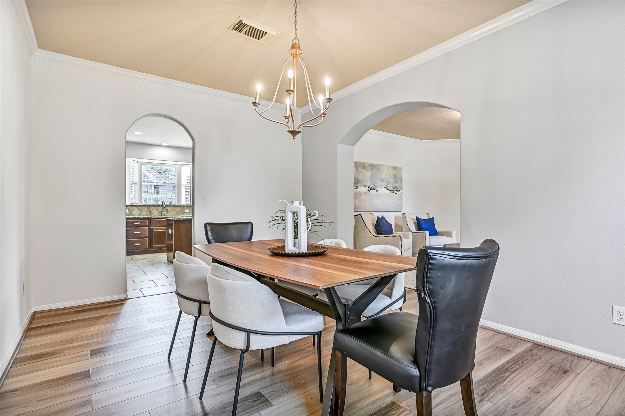 The formal dining room offers ample space for a large dining set and enjoys easy connectivity to both the formal living room and kitchen. A front-facing palladium window brings in natural light, while the updated finishes and open flow make this room equally suited for everyday meals or memorable celebrations.