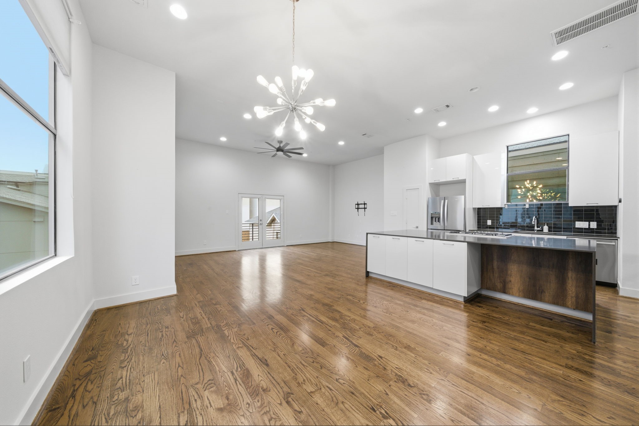 Modern light fixture in the Dining area! Plenty of room for a large Dining table - great for entertaining friends and family!