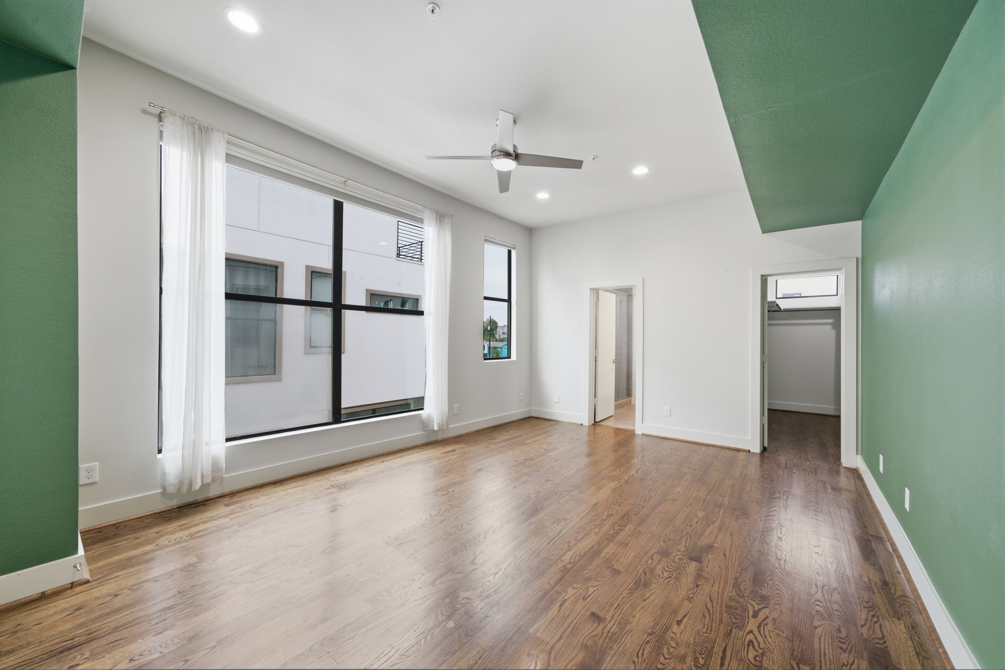 This is your Primary Bedroom OASIS! Doorway on the right is the LARGE WALK-IN CLOSET, and the doorway on the left is the Primary en-suite bathroom!