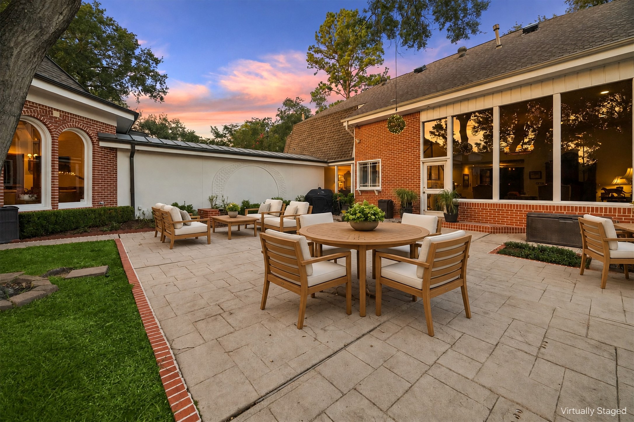 Virtually Staged - Discover the perfect outdoor retreat with an expansive back patio designed for cozy fire pit gatherings, elegant al fresco dining, and multiple lounging areas to relax and entertain.