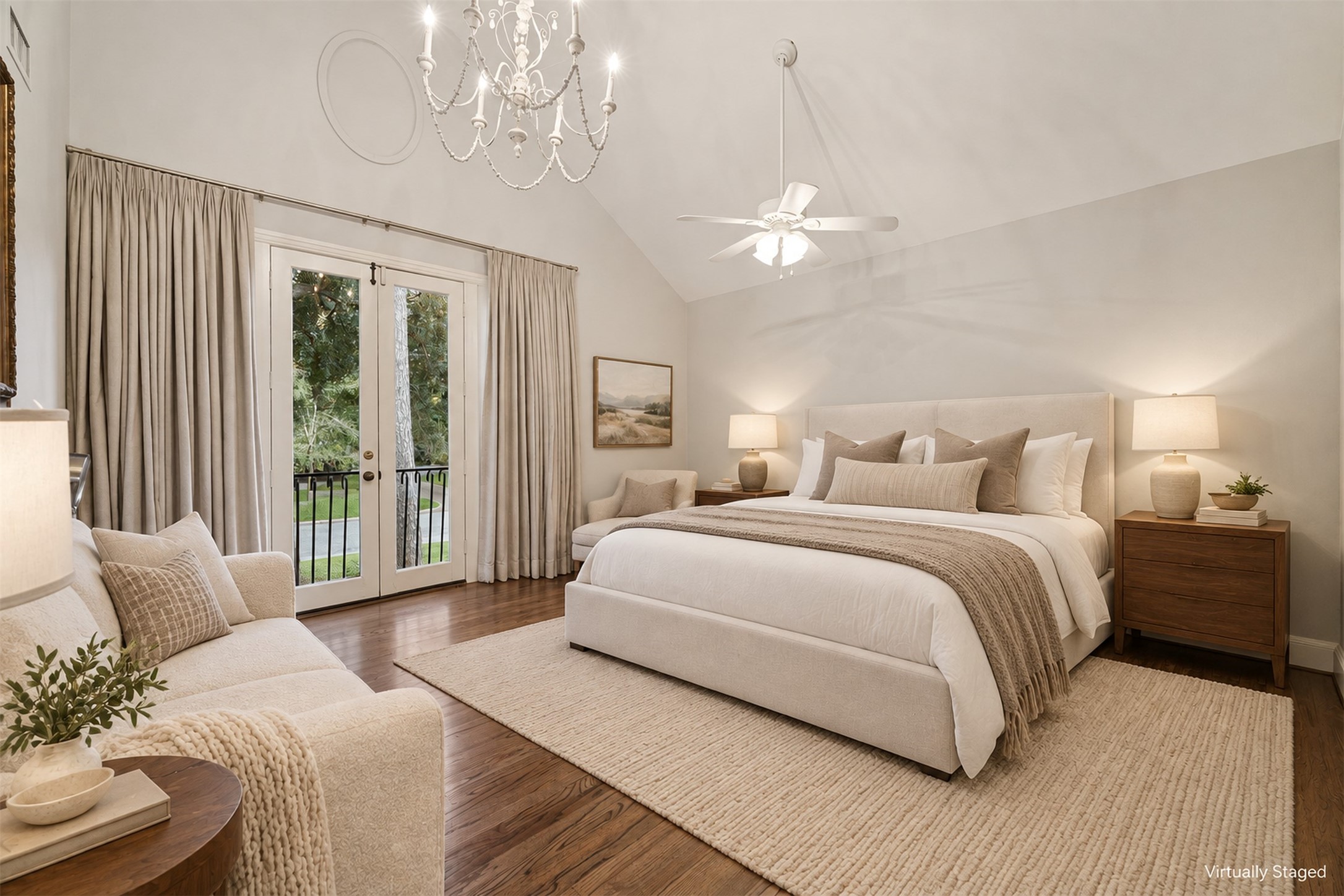 Virtually Staged -Secondary bedroom with vaulted ceilings, a graceful chandelier, wood floors and a walk-in closet.