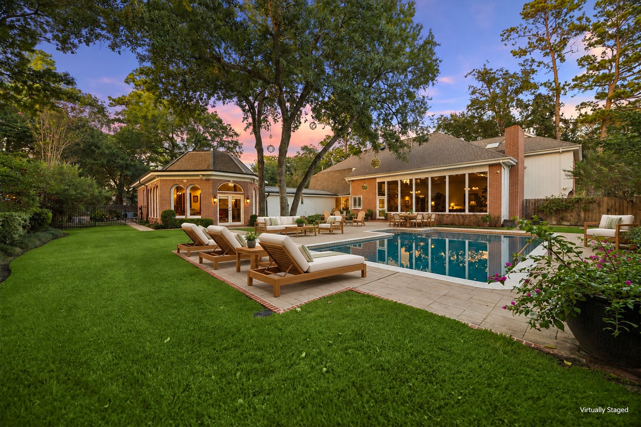 Virtually Staged - Tranquil and spacious backyard with beautiful, mature landscaping.
