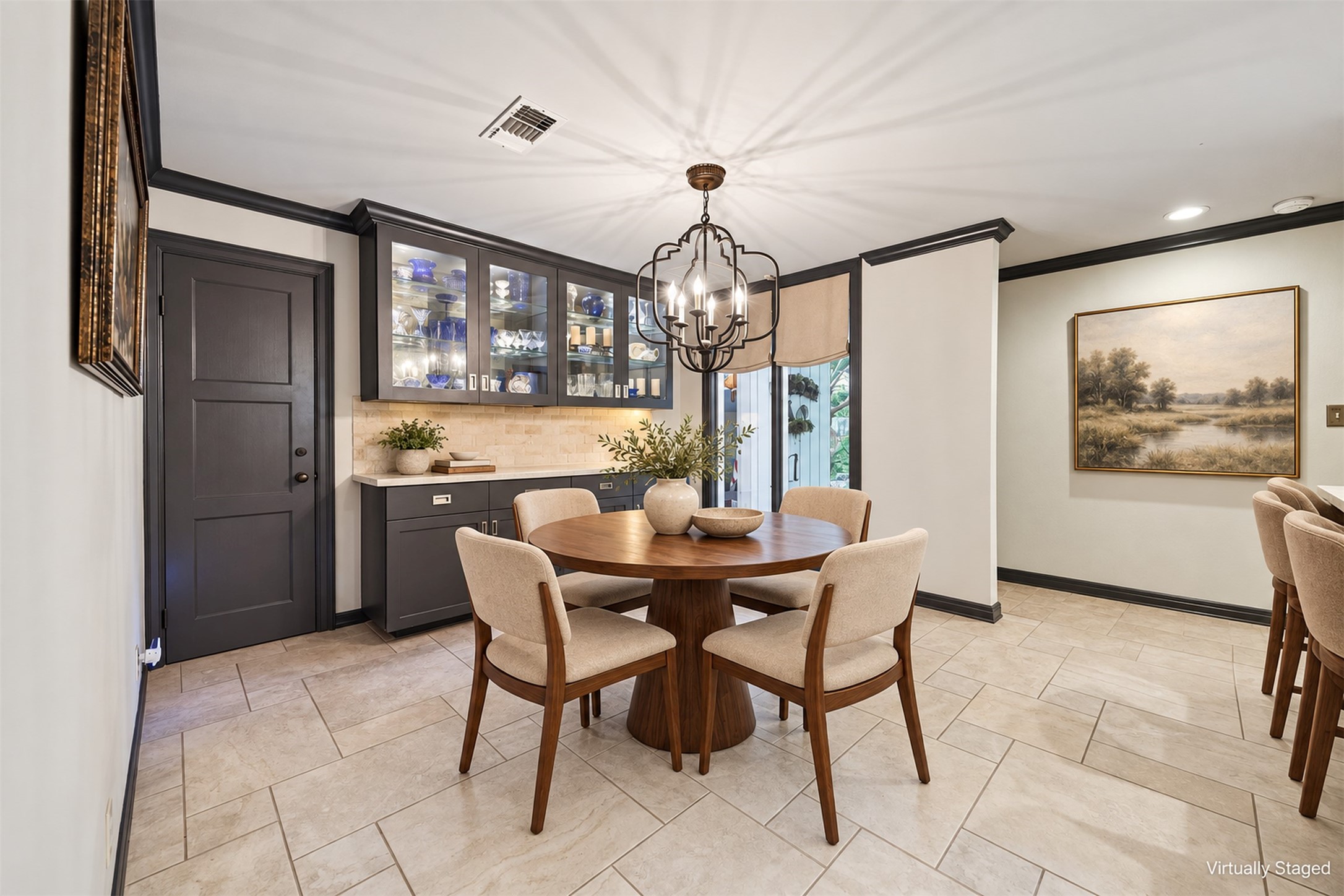 Virtually Staged - Breakfast room located just off of the kitchen, features built-in banquet and storage closet.