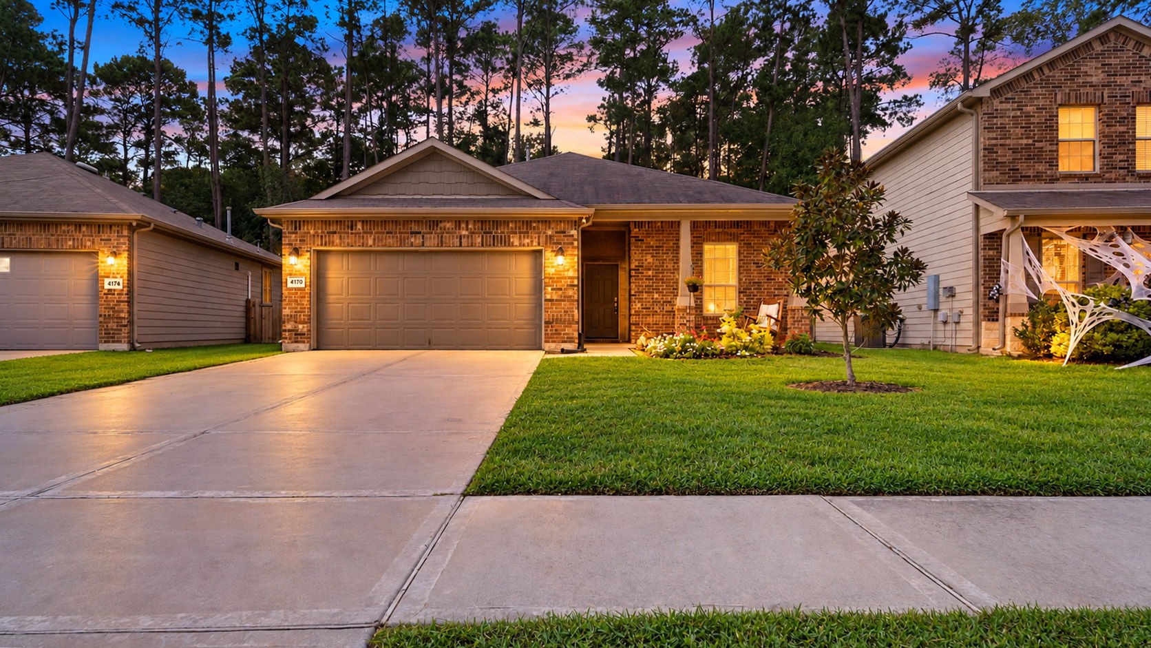 Picture yourself coming home to this! Beautiful evening lighting, charming brick exterior, and inviting curb appeal make this single-story home a welcoming place to call your own.