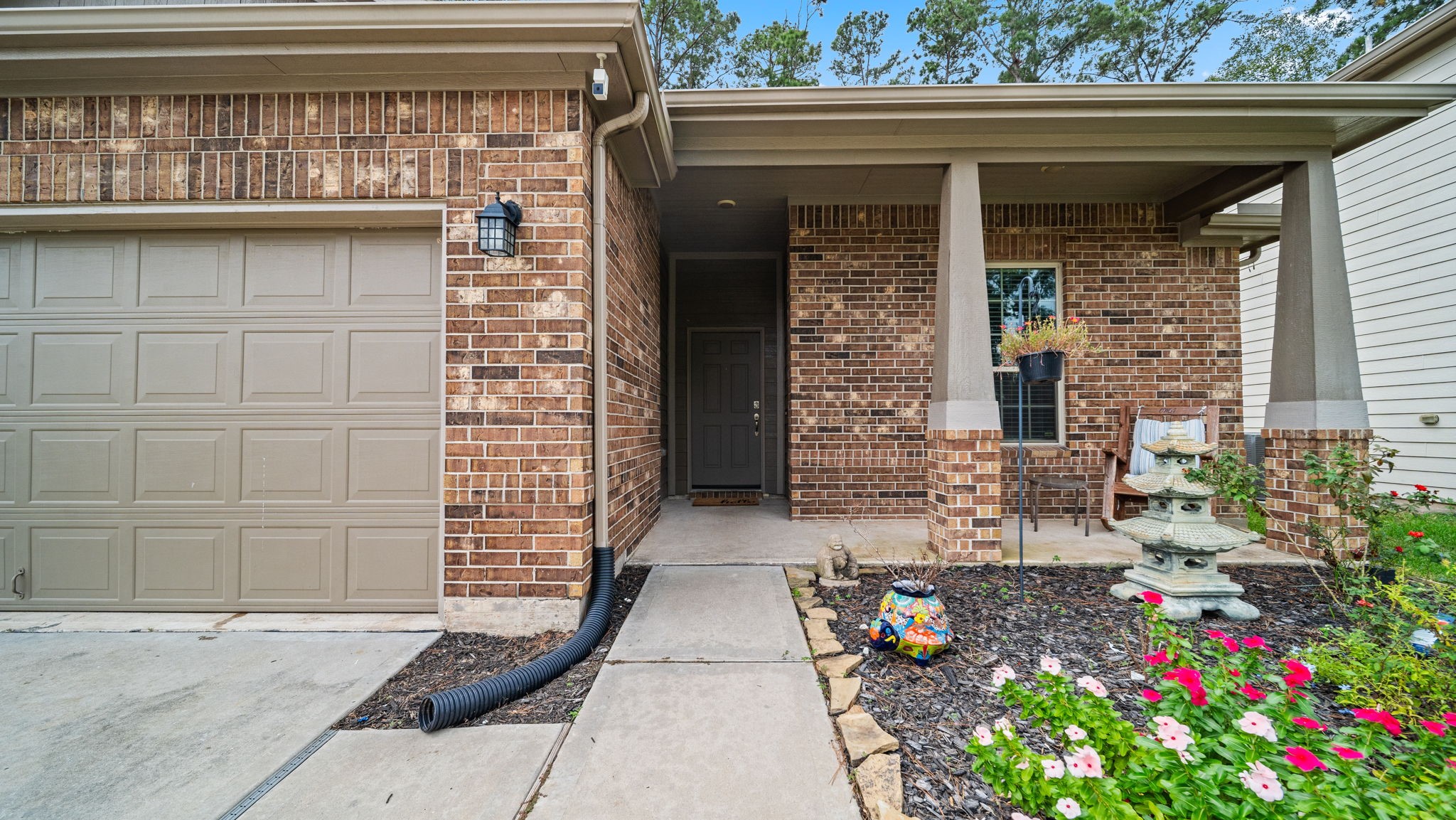 Come on in! Enjoy a welcoming covered front porch with attractive landscaping and a sheltered entryway. Come on in! Enjoy a welcoming covered front porch with attractive landscaping and a sheltered entryway.
