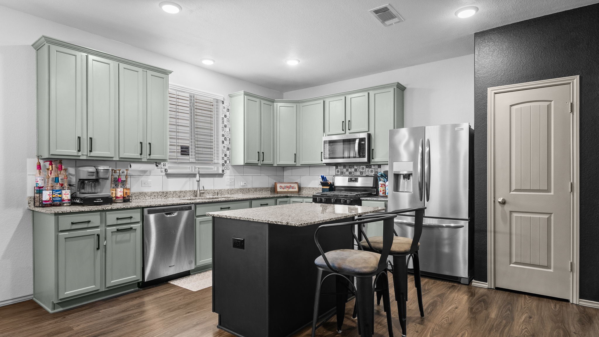 You'll love this kitchen! Granite countertops, stainless steel appliances (refrigerator included), abundant cabinetry, pantry, and a center island make cooking and entertaining a pleasure. You'll love this kitchen! Granite countertops, stainless steel appliances (refrigerator included), abundant cabinetry, pantry, and a center island make cooking and entertaining a pleasure.