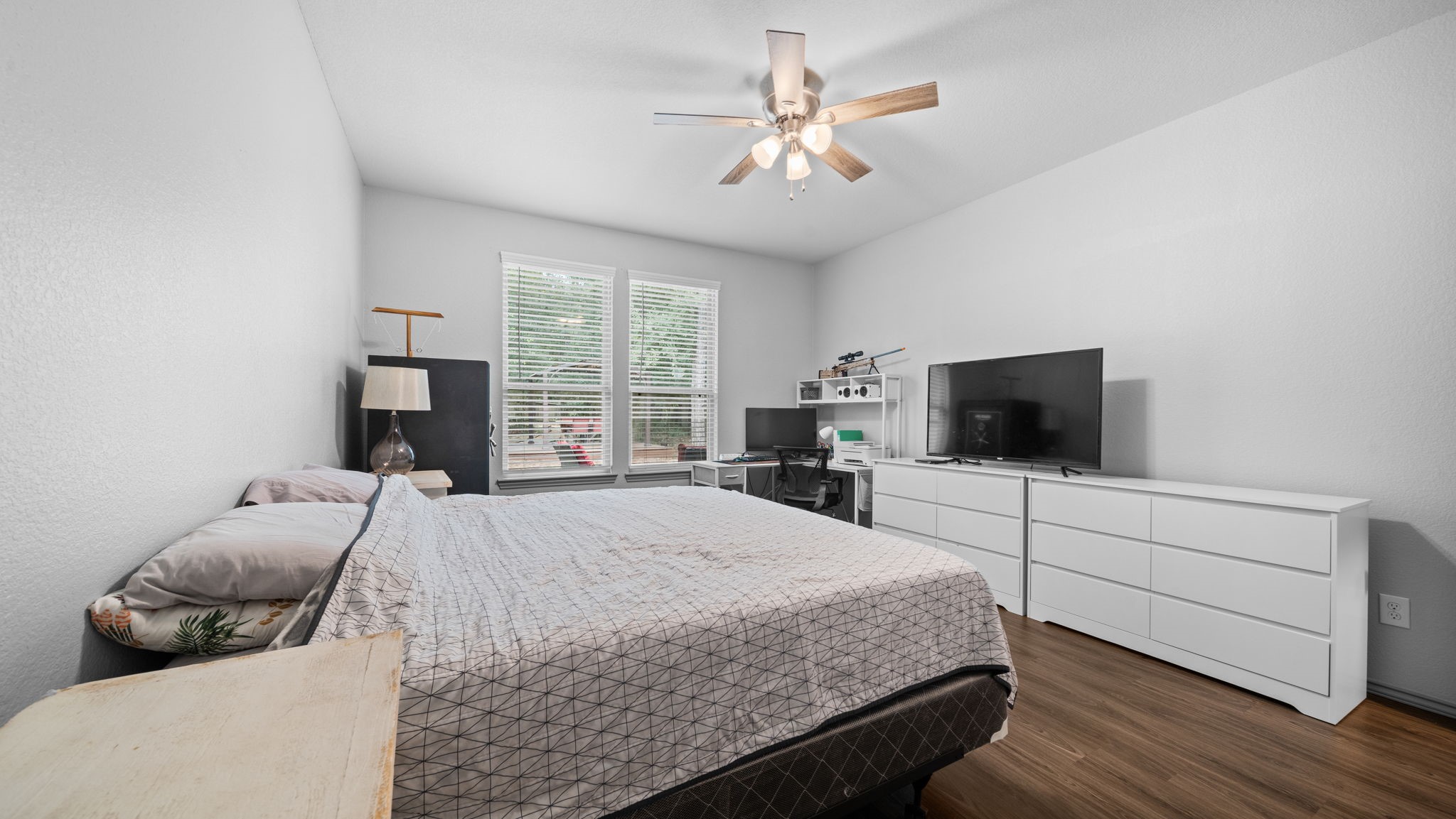 Room to relax and unwind! This primary suite offers generous space, natural light, and easy-care flooring.