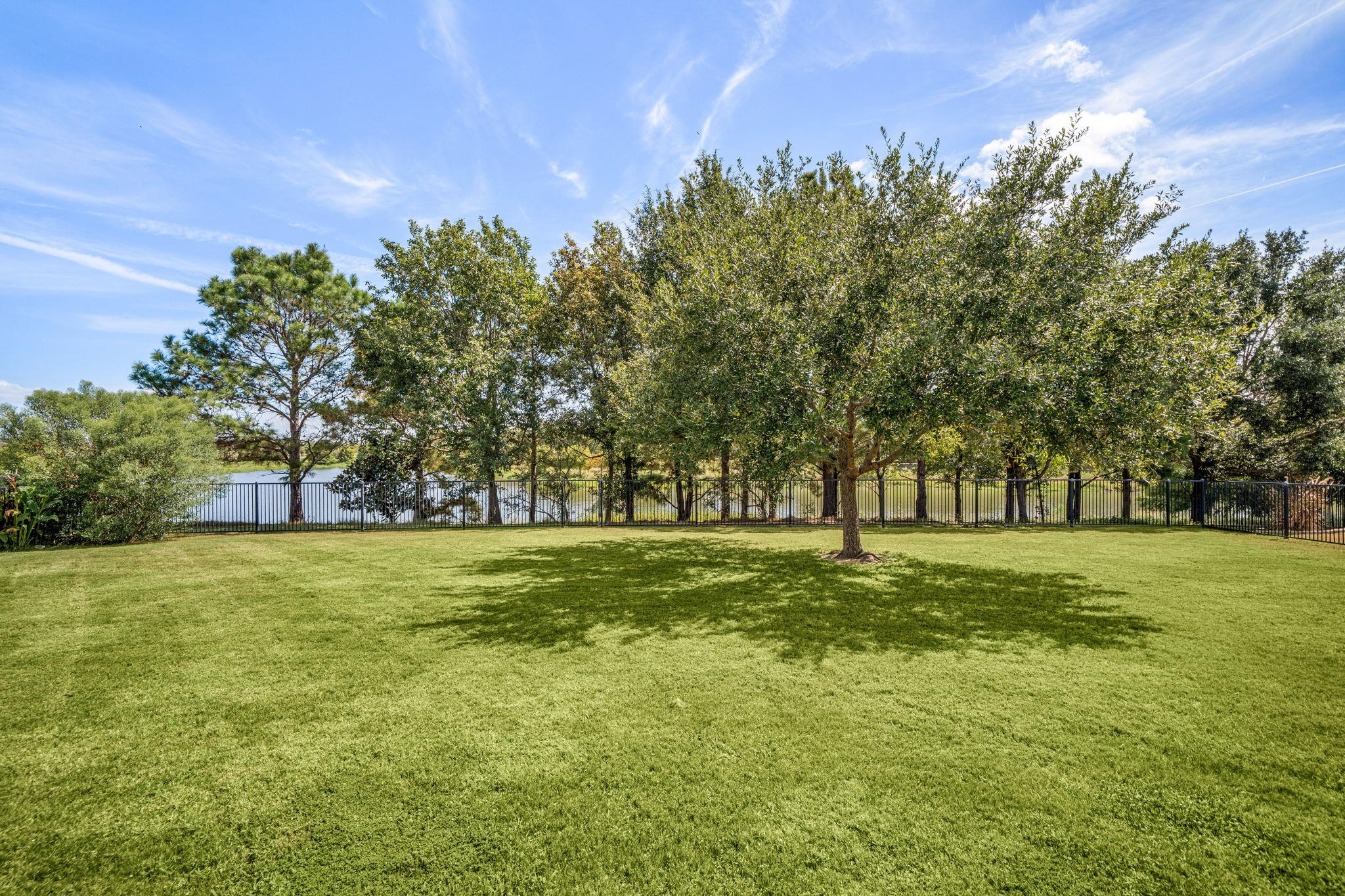 The generous lot leaves space for a pool, garden, or play area, all within the privacy of a fully fenced yard.