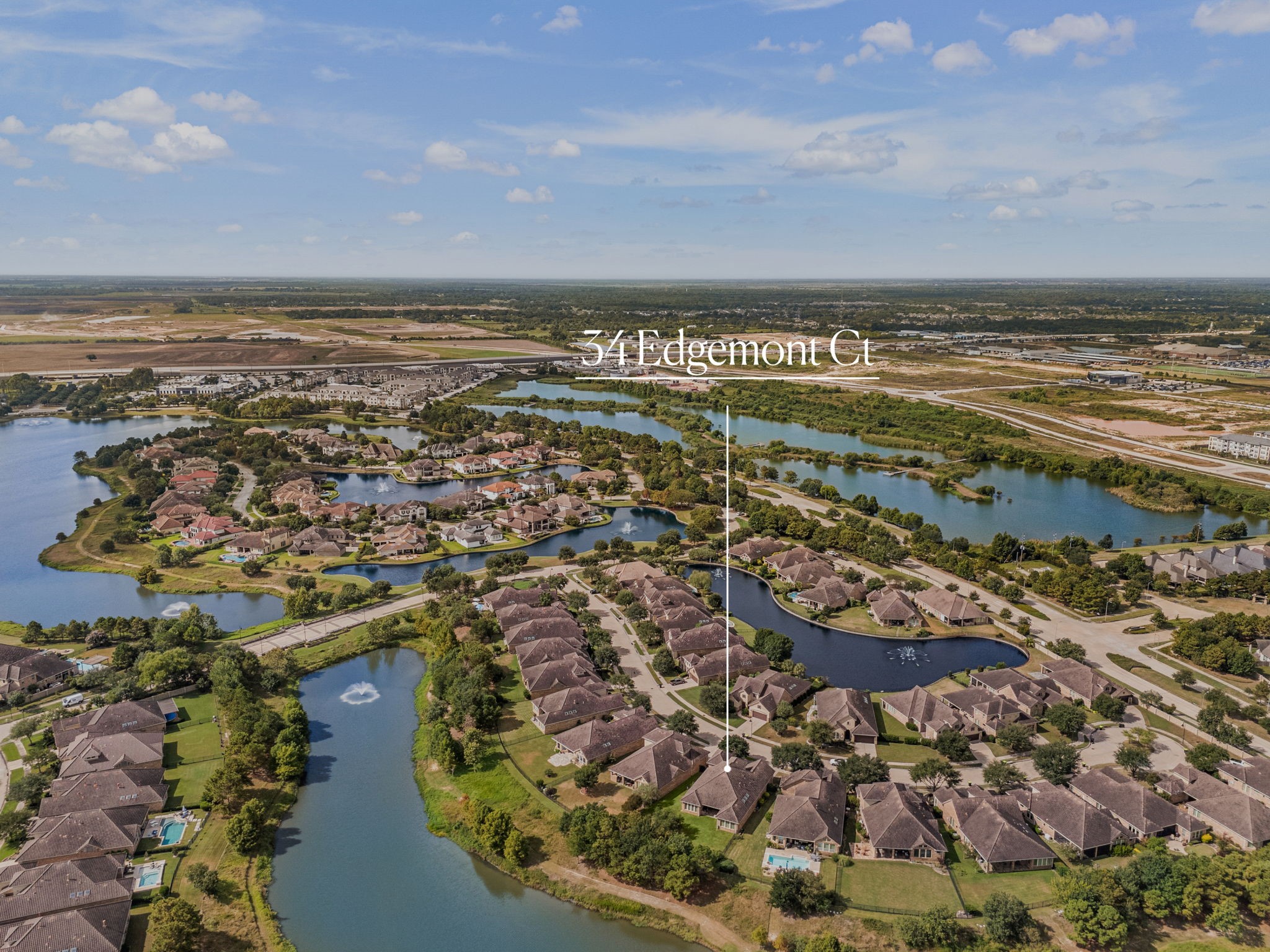 Positioned along the water, this view captures 34 Edgemont Ct's proximity to the community's lake and scenic walking paths.