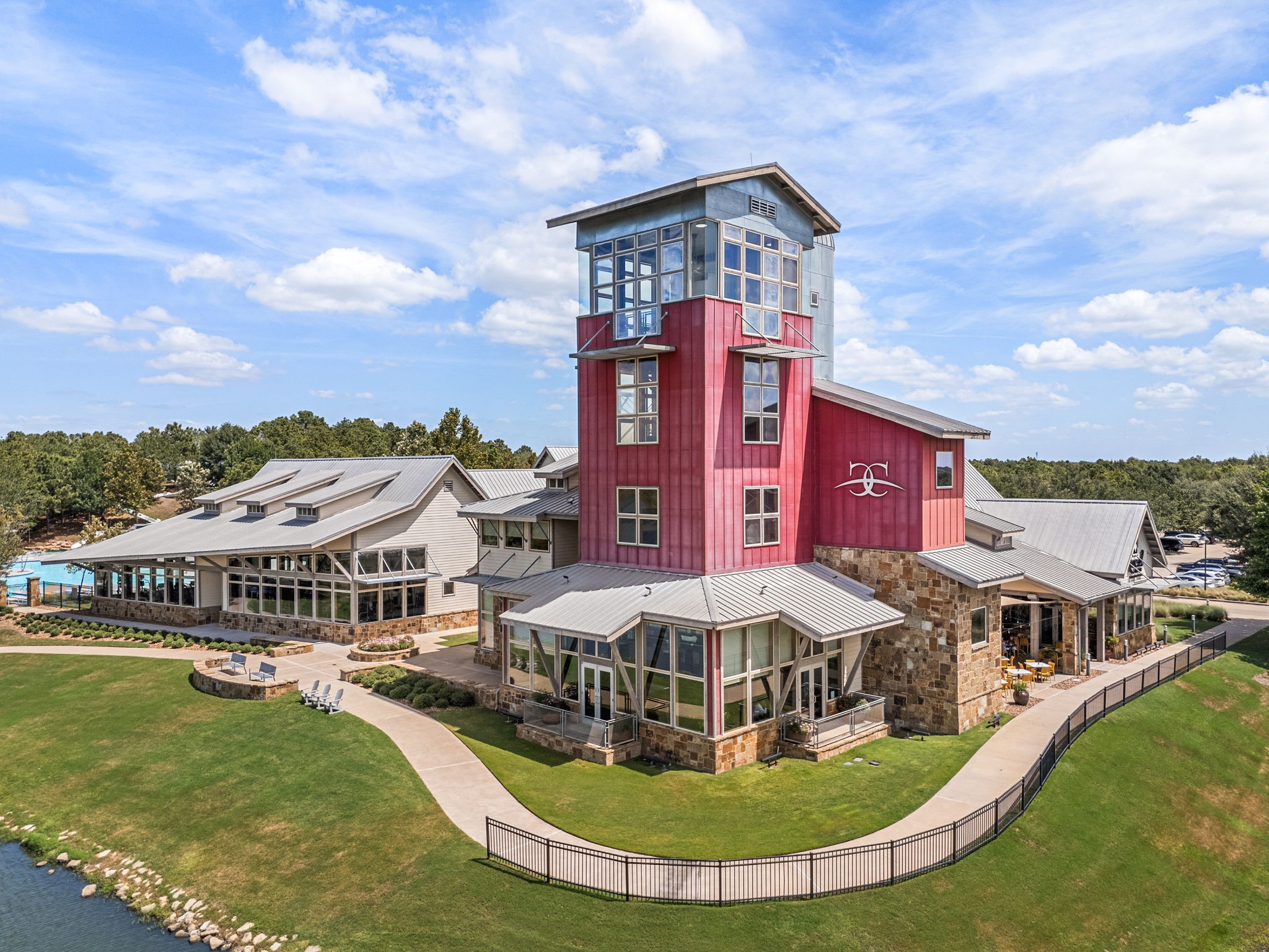 This landmark is the Cross Creek Ranch Community Center in Fulshear, recognized by its 70-foot observation tower. Residents use the complexs 6,500-square-foot fitness center, group classes, and reservable community room, while onsite Local Spot offers a convenient neighborhood destination for dining and gathering.