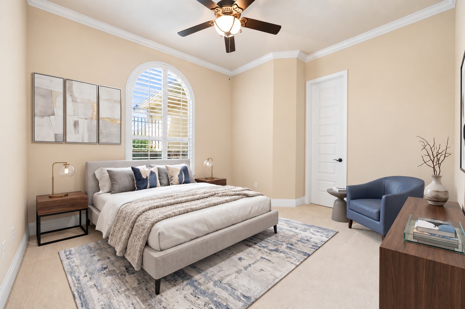 This secondary bedroom offers a bright, versatile space with plush carpet and a ceiling fan. Virtually staged.