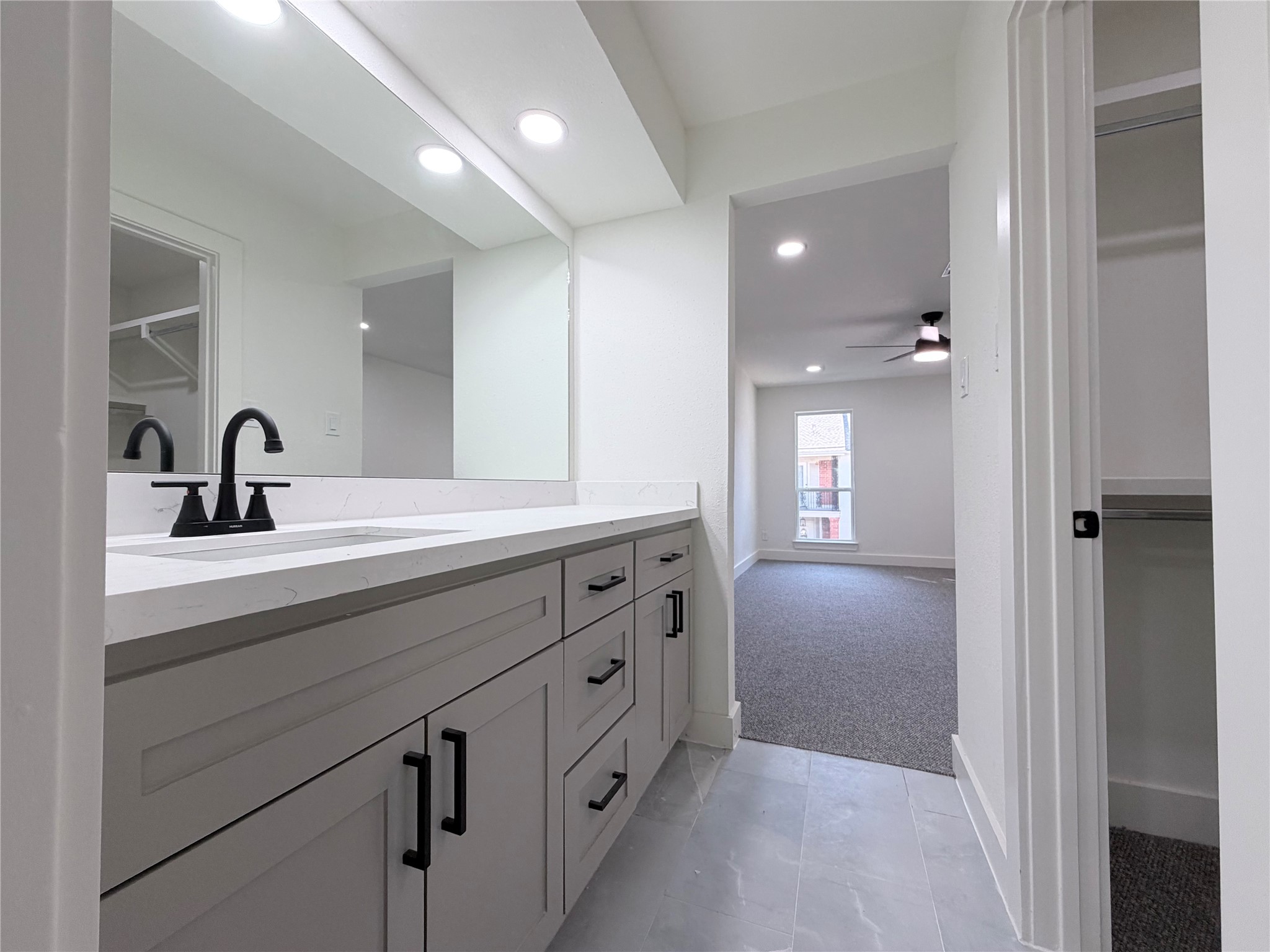 Primary bedroom offer double sinks with seperate vanities and walk in closet on the left.