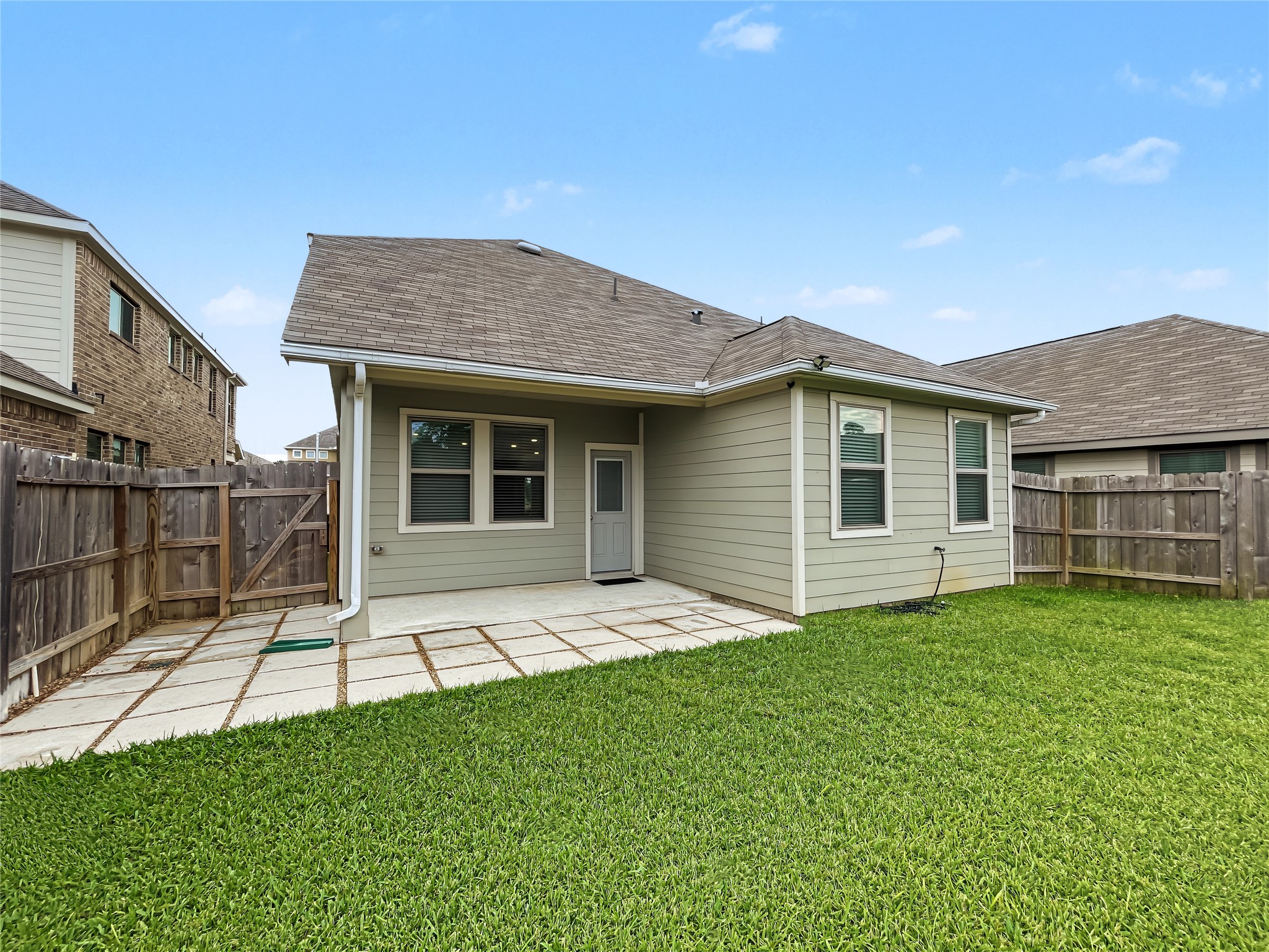 View of the backyard and the back elevation of this nice property.