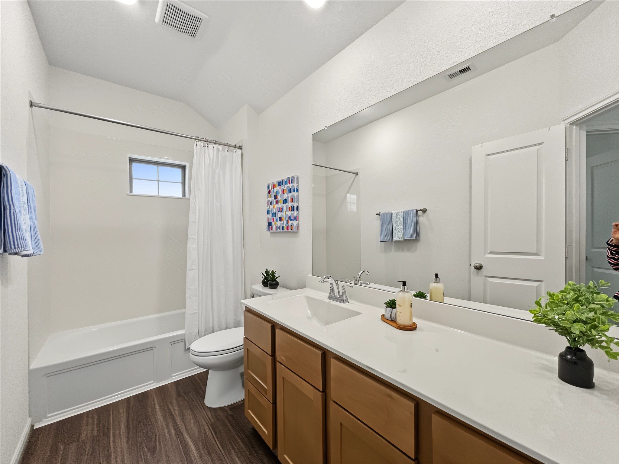 The secondary bathroom offers a tub/ shower combo, and a nice vanity.