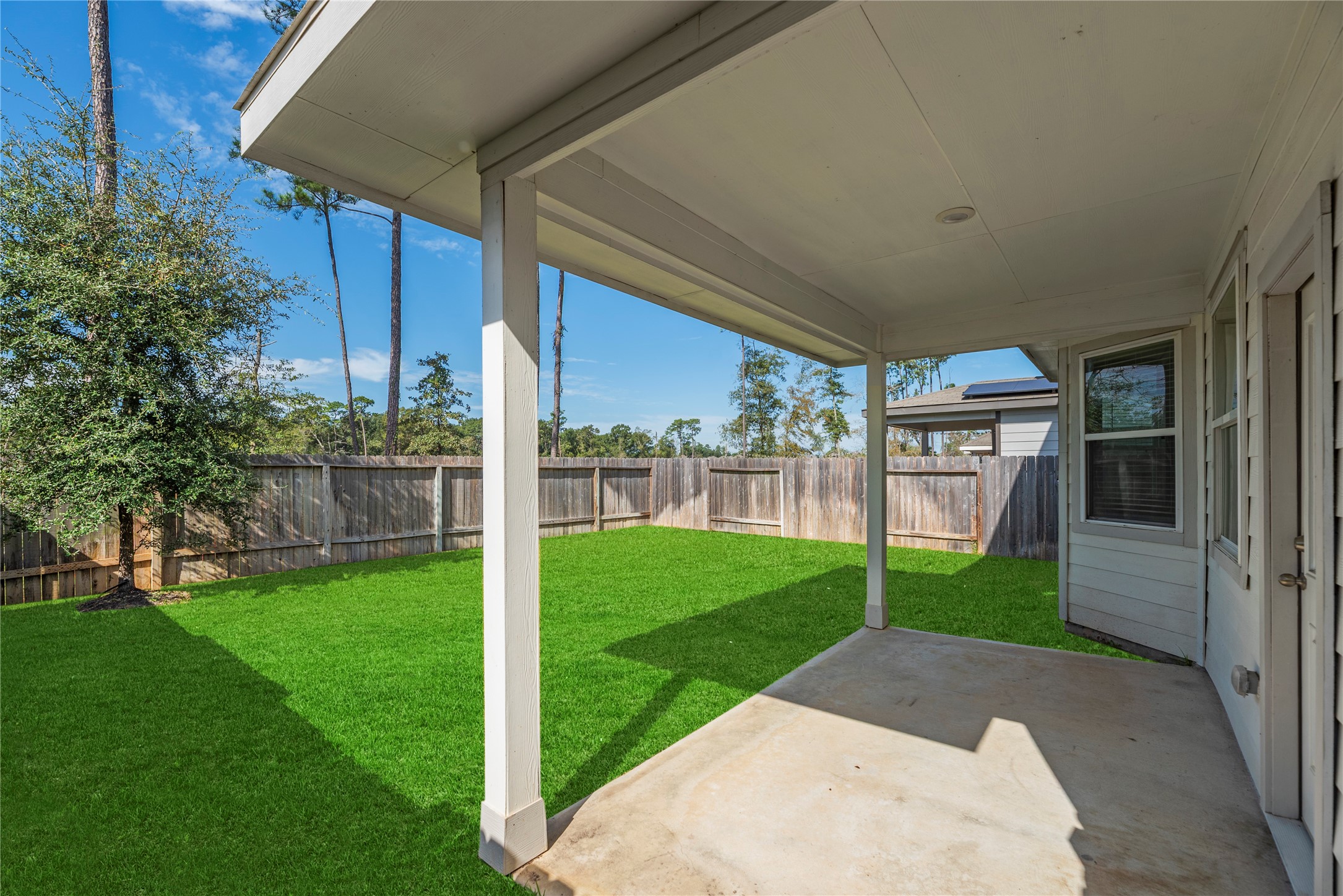 Covered rear patio for outdoor                                   relaxation and enteraining.