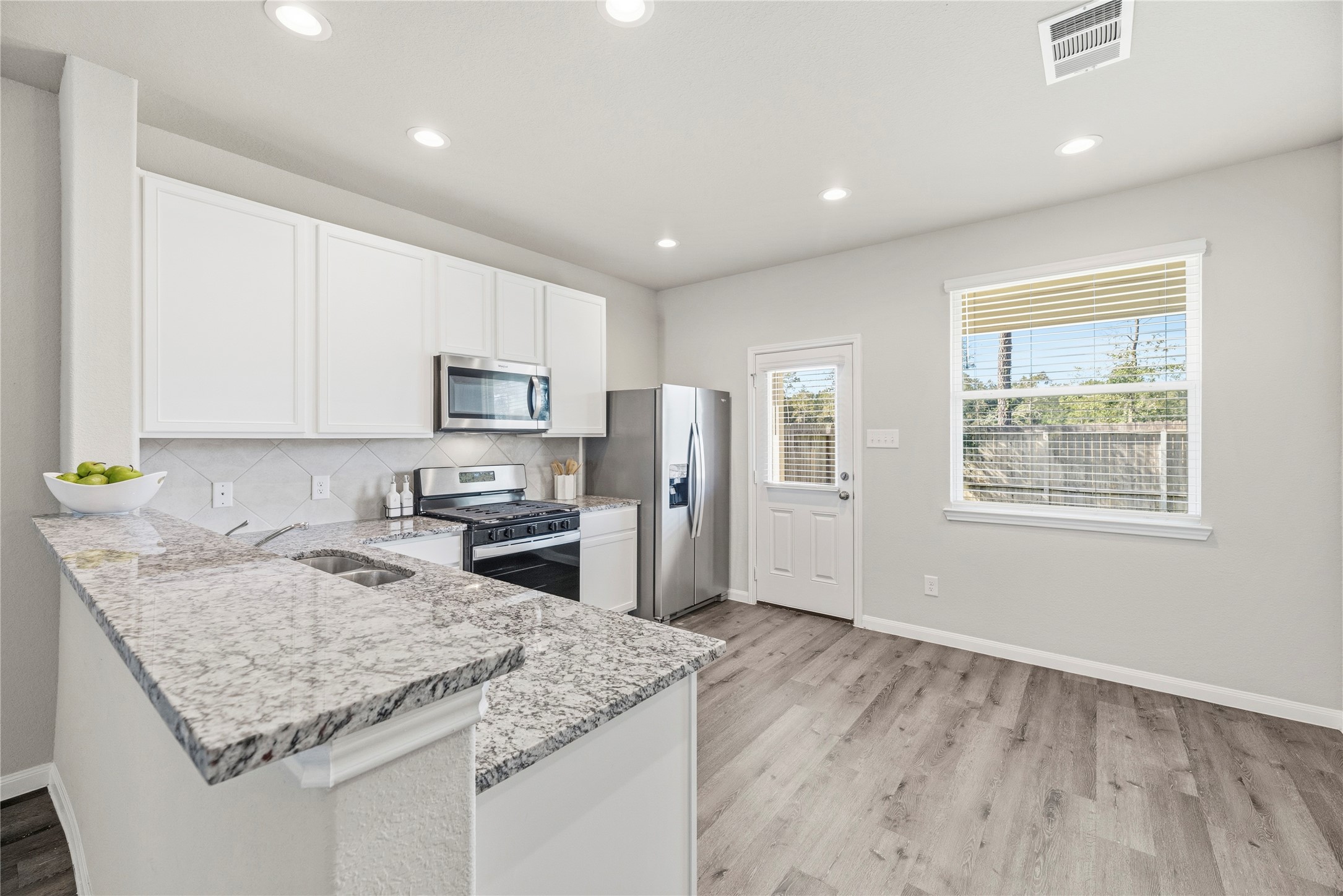 Kitchen and dining area with backyard access