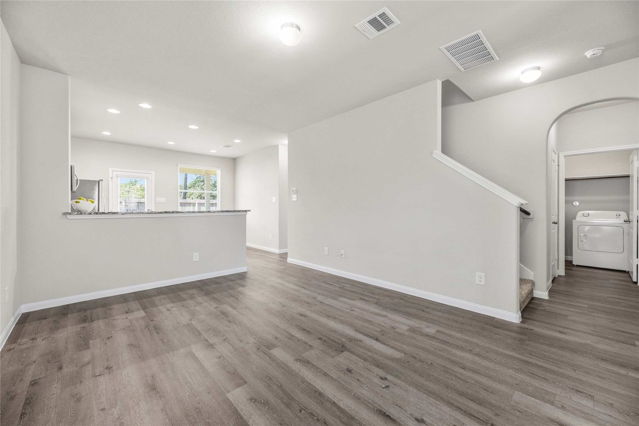 Open living, dining, kitchen layout.
