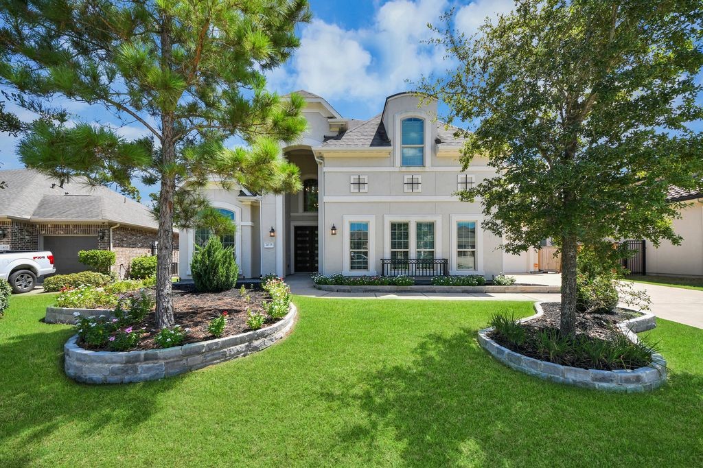 Notice the extensive stone landscape pavers, & lovely front elevation. Notice the extensive stone landscape pavers, & lovely front elevation.