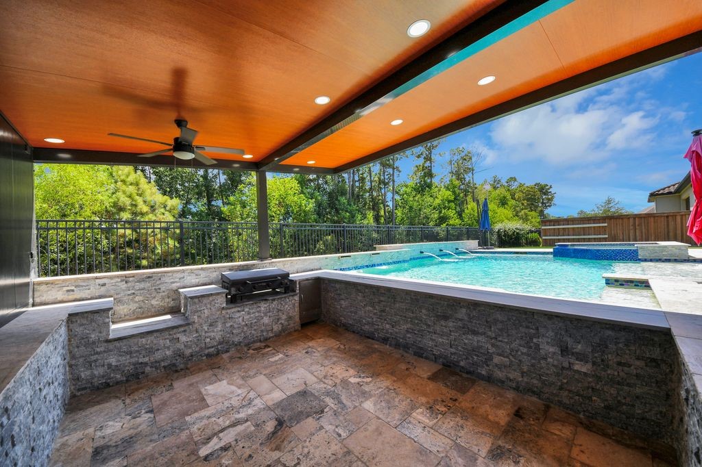 Extensive stonework adorns this covered area with views of the greenbelt!